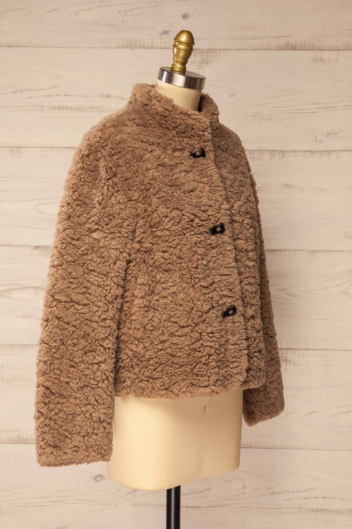 side view of Fadina Brown Toggle Closures Sherpa Jacket with Pockets at La petite garçonne