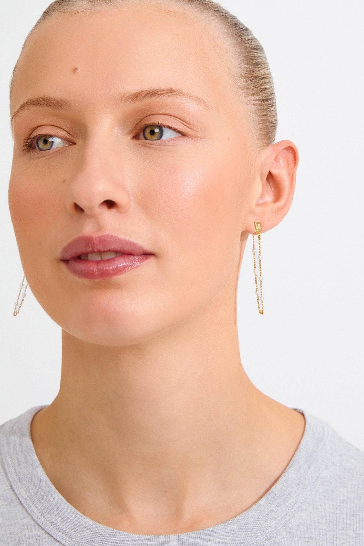view of a woman wearing Farida Gold Loop Chain Earrings with Pearls by Pilgrim from La petite garçonne