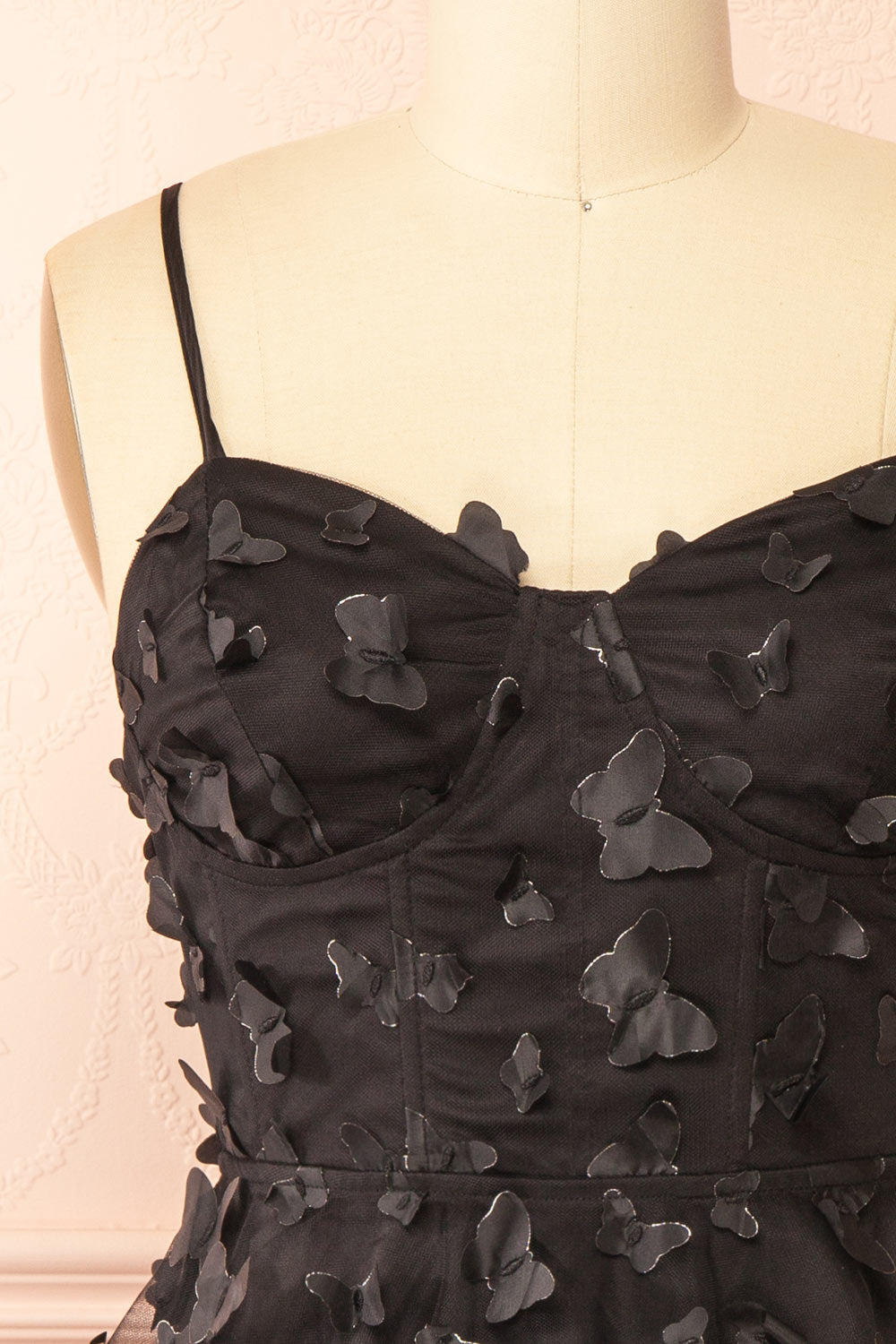 front of sewing Mannequin wearing Faya Black Short Corset Dress with Butterflies From Boutique 1861
