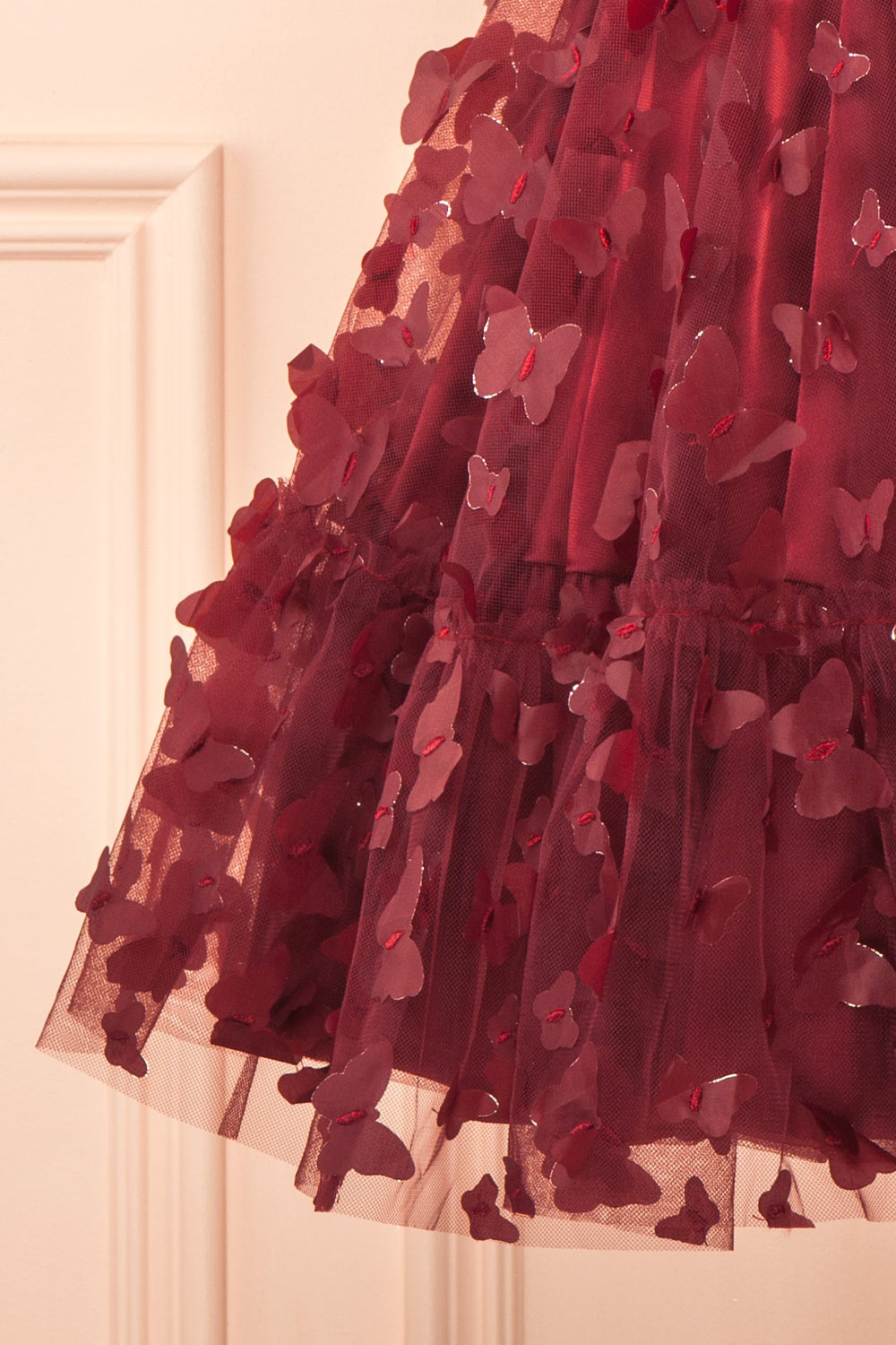 bottom of a sewing mannequin wearing Faya Burgundy Short Corset Dress with Butterflies from Boutique 1861