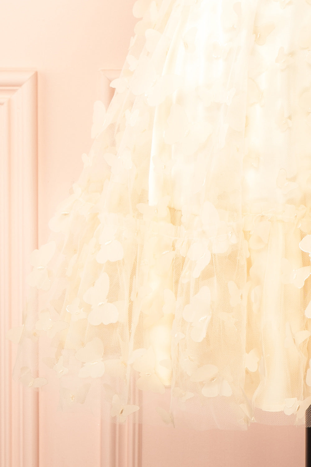 bottom of sewing Mannequin wearing Faya Ivory Short Corset Dress with Butterflies From Boutique 1861