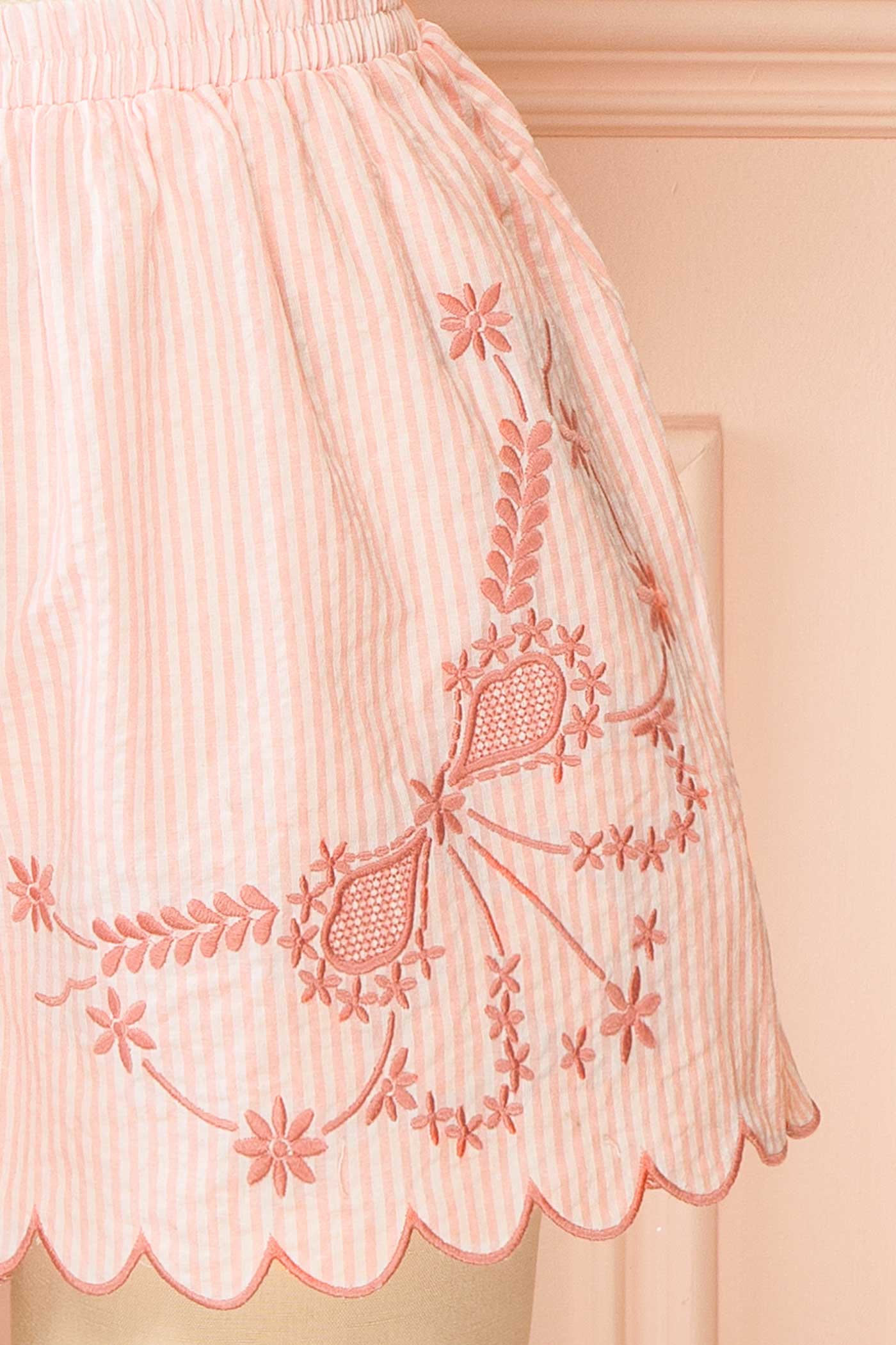 Close-up view Fineas Pink Embroidered Striped Pajama Shorts with Scalloped Hem at boutique 1861