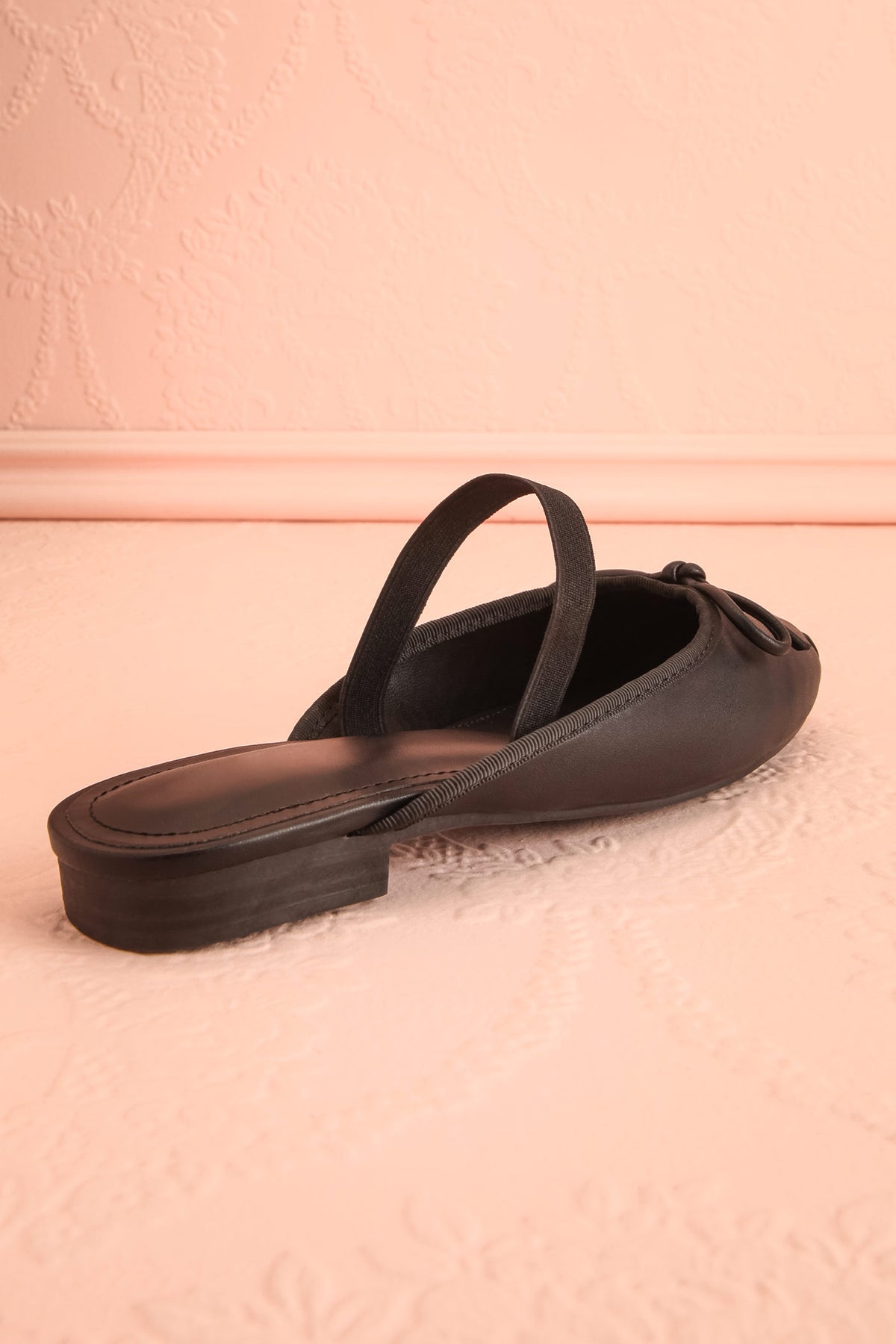 back view of Finnian Black Ballet Mule Flats at Boutique 1861