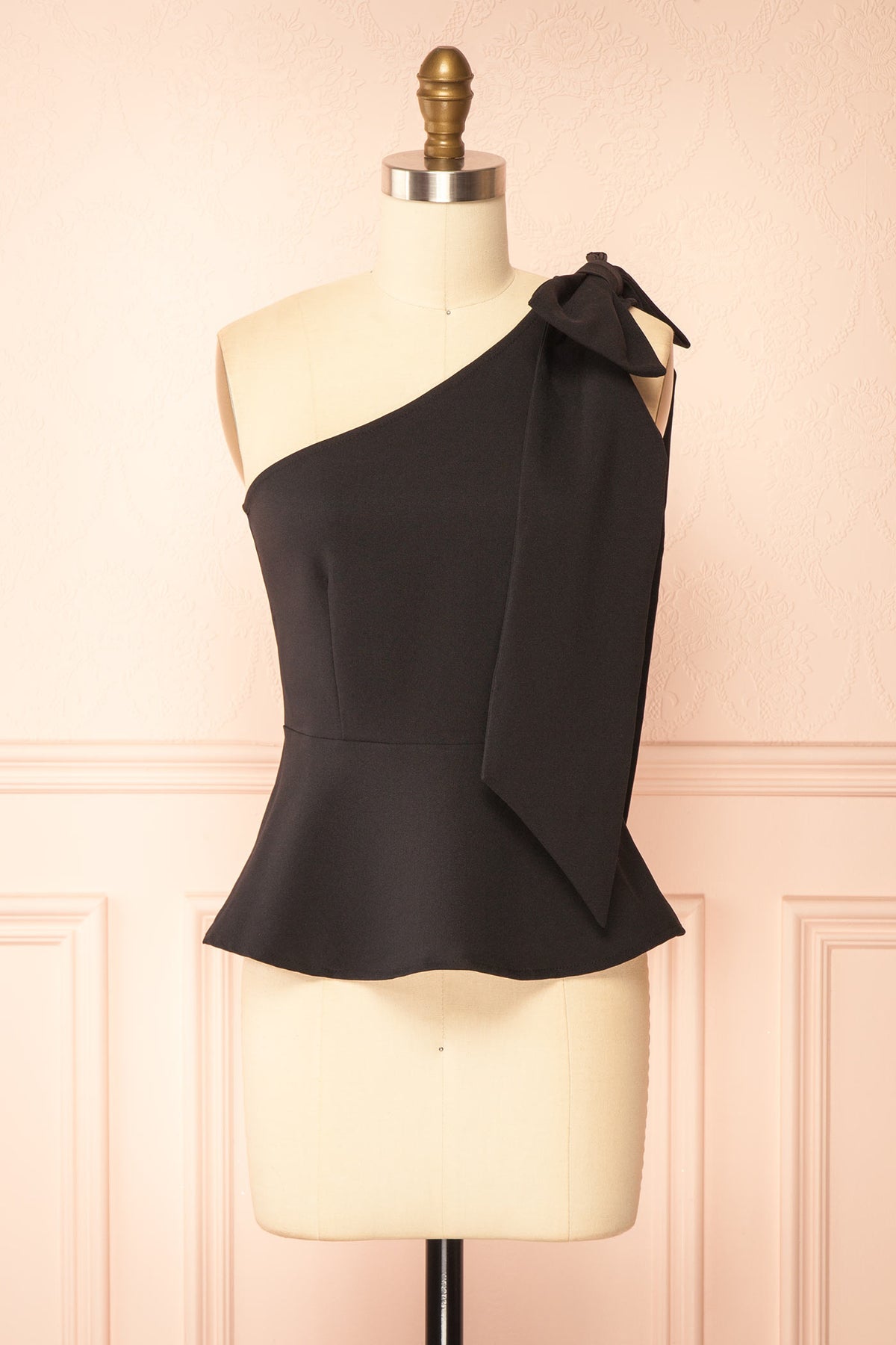 Front view of Galiote Black One-Shoulder Bow Peplum Top at Boutique 1861