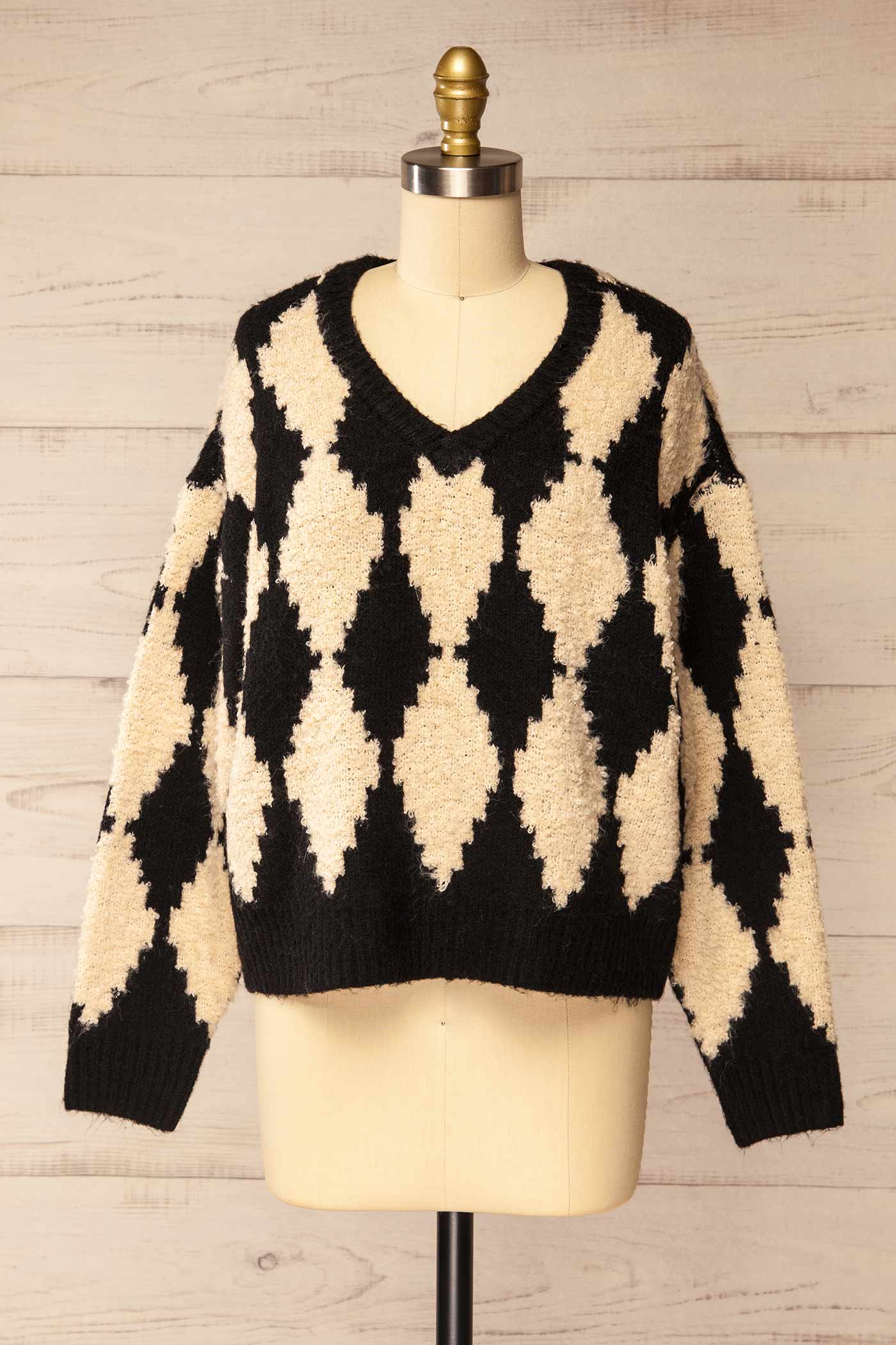 front view of Gawler Black Oversized Argyle V-Neck Knit Sweater at La petite garçonne