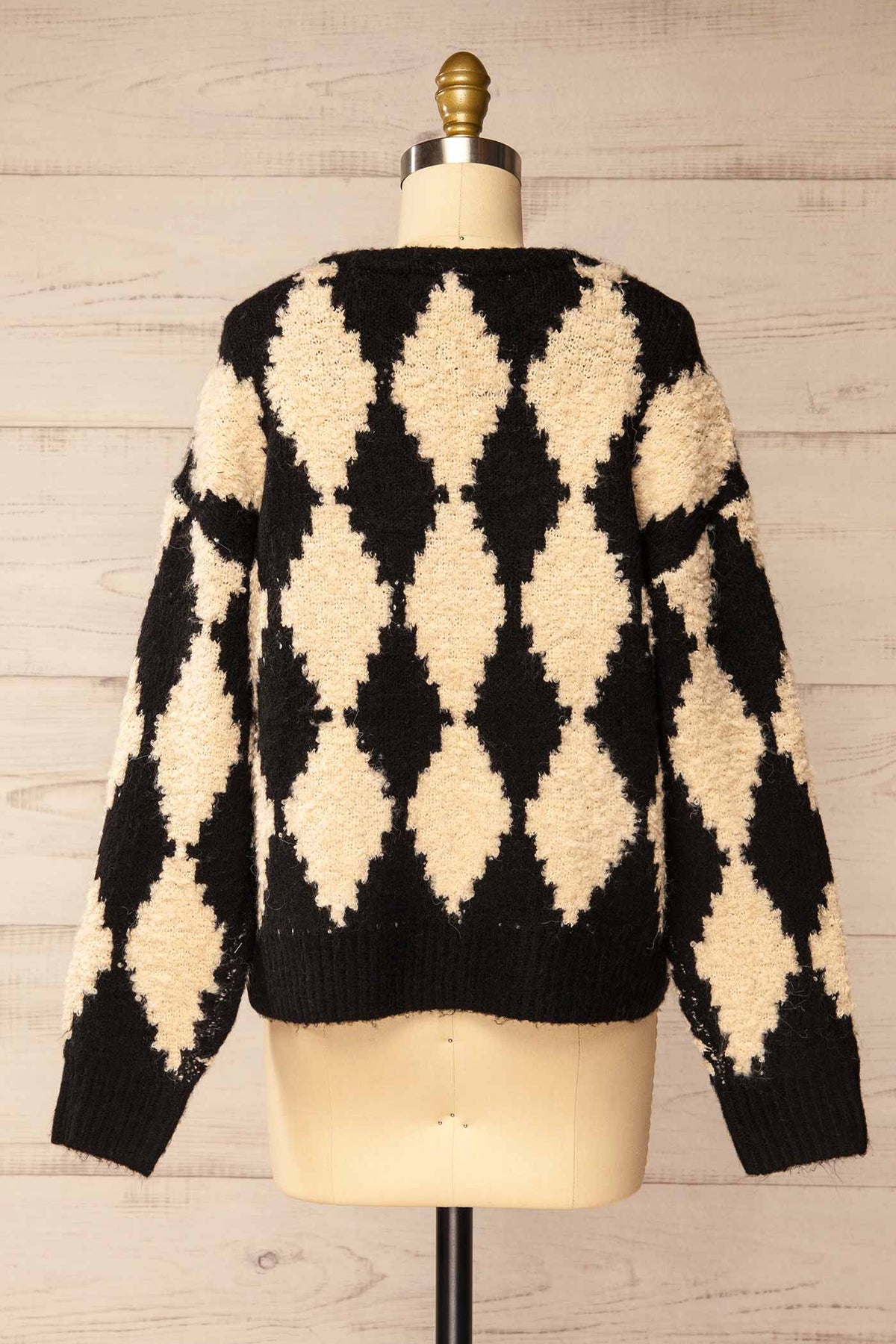 back view of Gawler Black Oversized Argyle V-Neck Knit Sweater at La petite garçonne