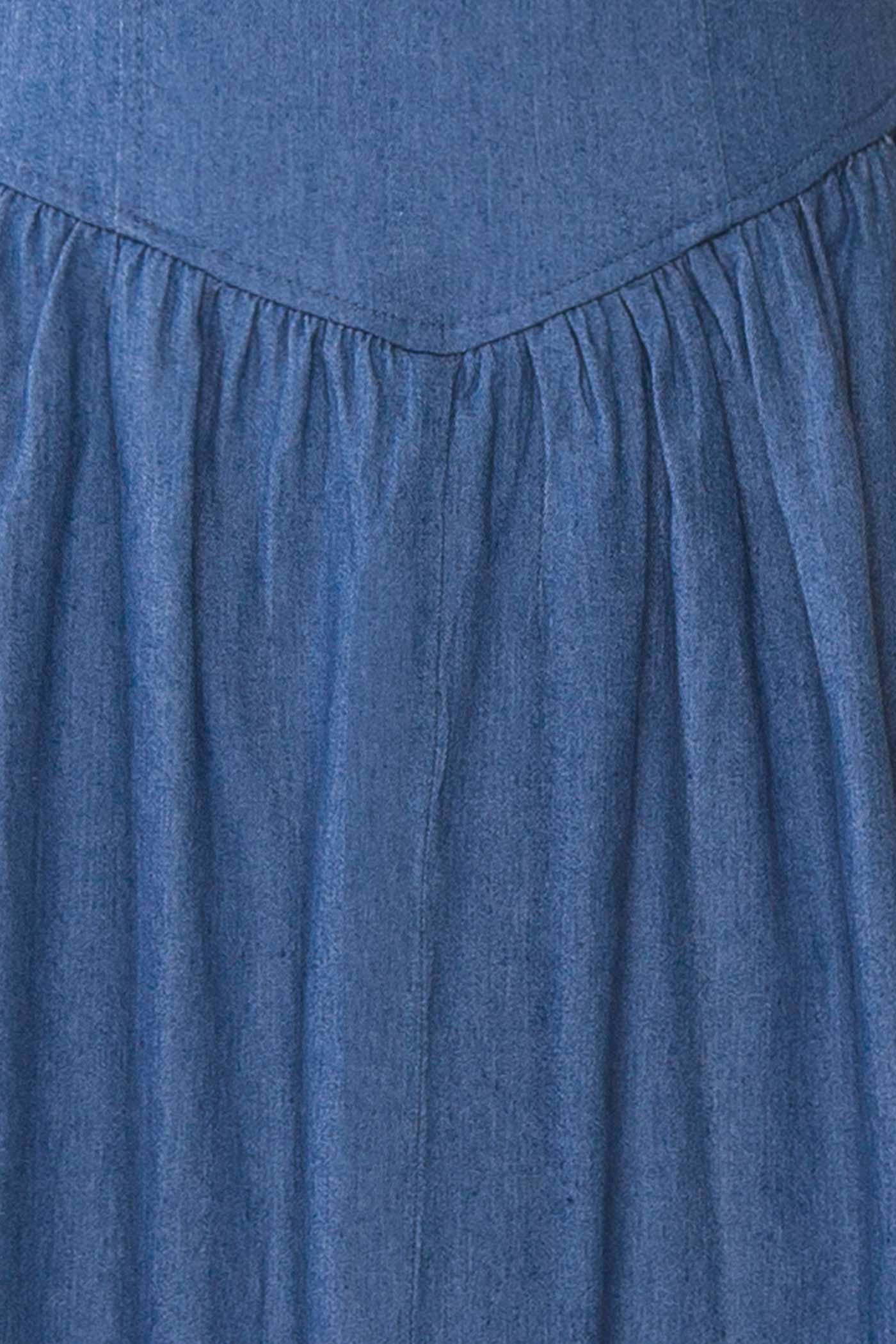 Close-up of Gerogene Blue Denim Midi Dress with Bow and Smocked Back at boutique 1861