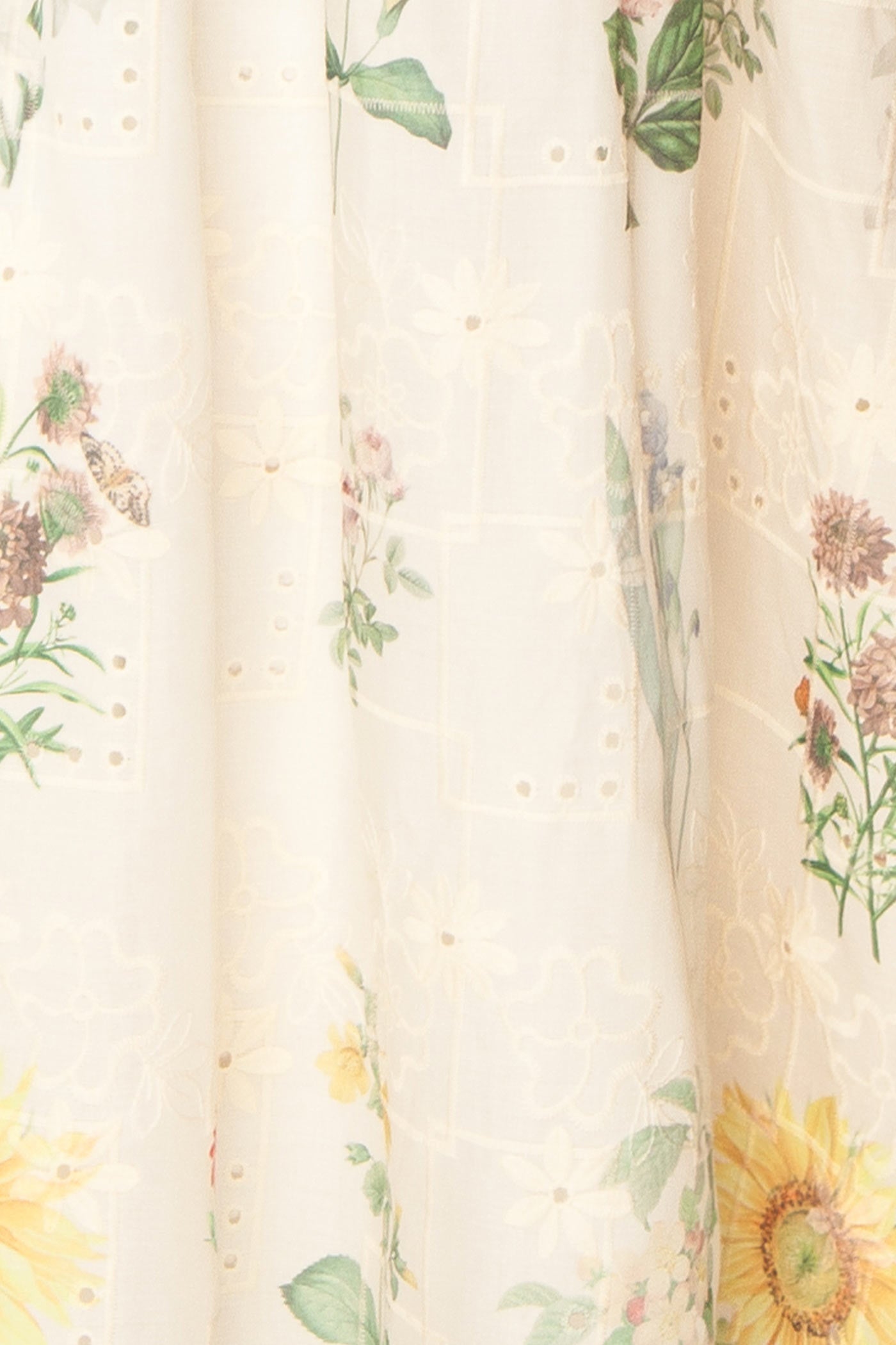 Close-up view of Hansi Floral Eyelet Drop-Waist Ivory Maxi Skirt at la boutique 1861