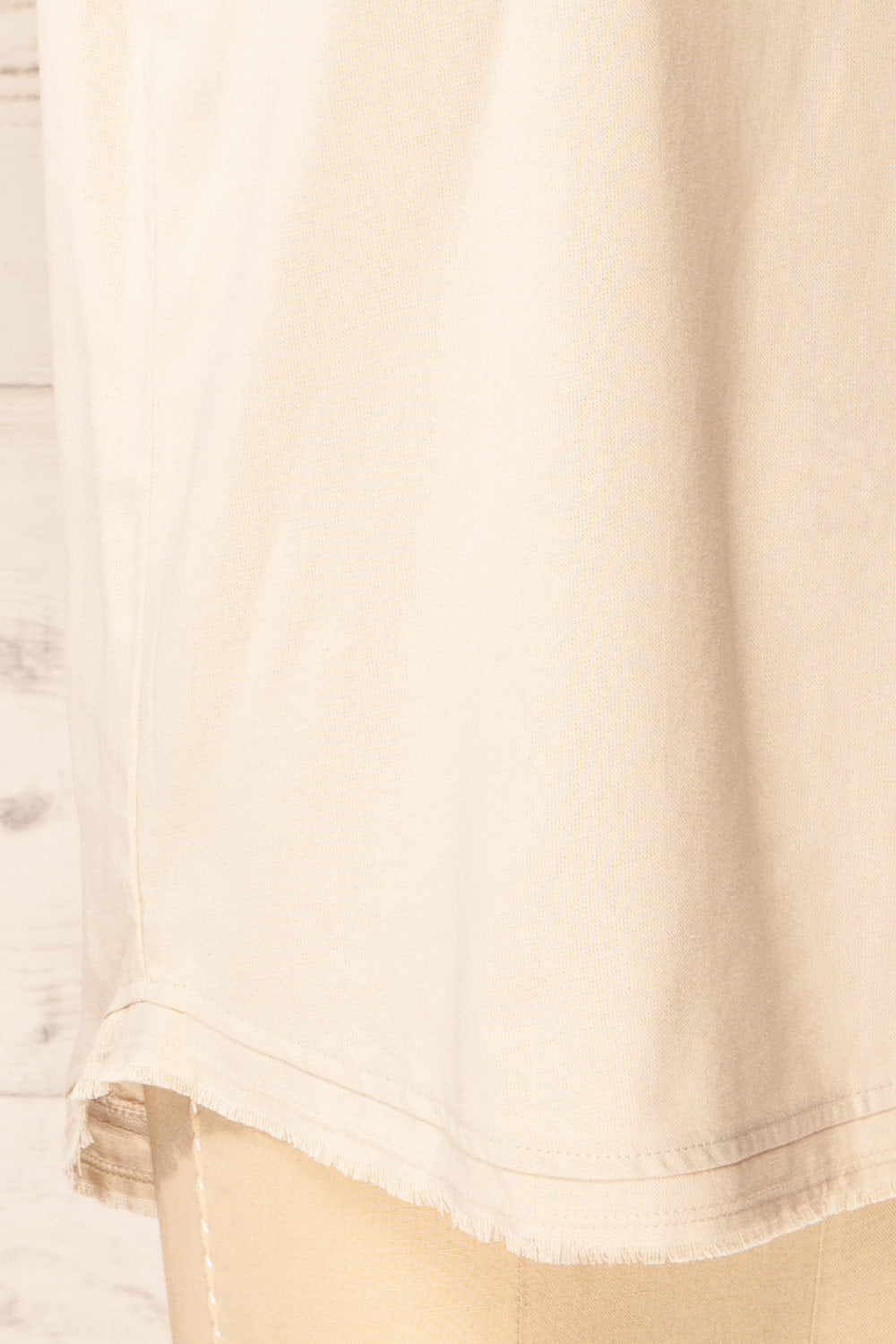 Helsinki Beige V-Neck Tank Top w/ Frayed Hem | La petite garçonne bottom close-up