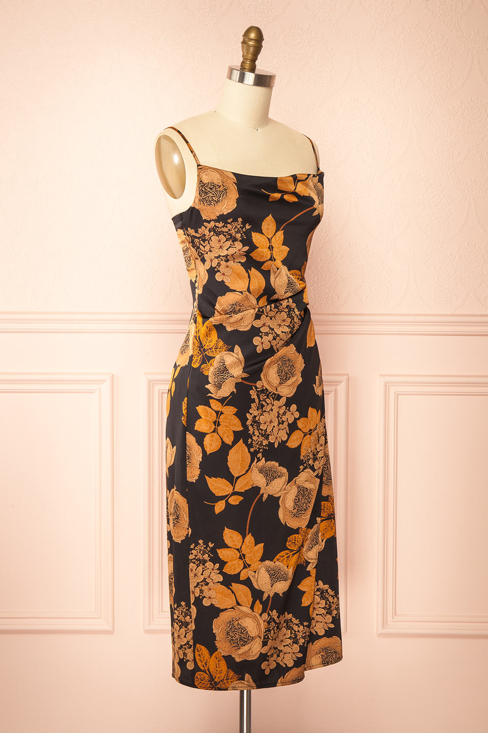 side view of sewing mannequin wearing Hinaya Black Floral Cowl Neck Satin Midi Slip Dress from Boutique 1861