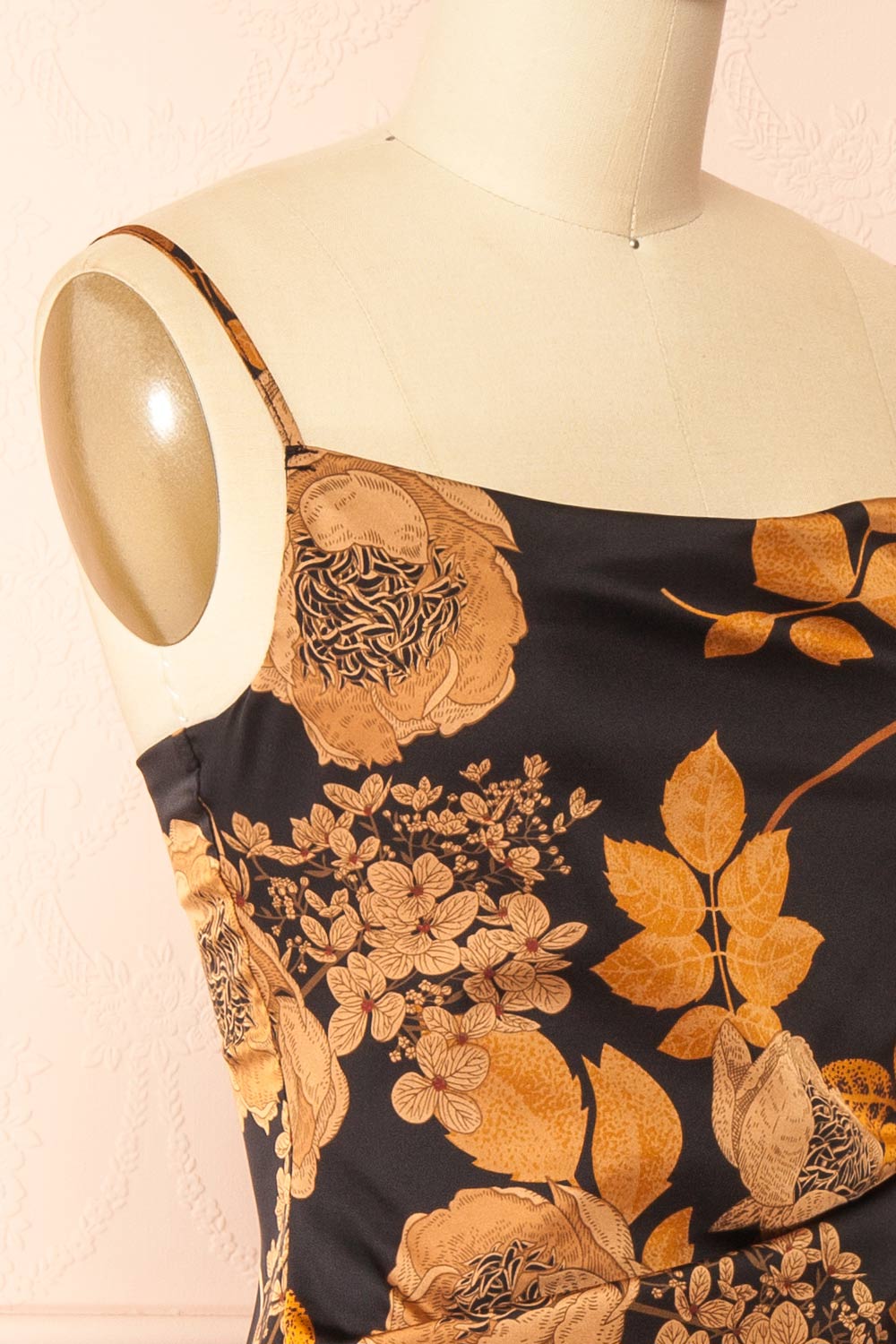 side of sewing mannequin wearing Hinaya Black Floral Cowl Neck Satin Midi Slip Dress from Boutique 1861