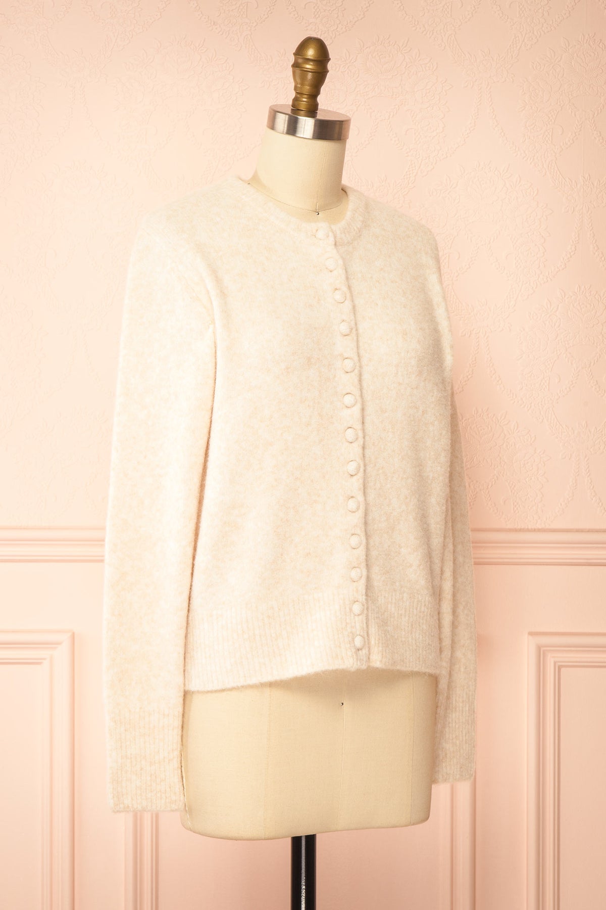 side view of Idalia Ivory Round Neck Cardigan With Button Front at Boutique 1861