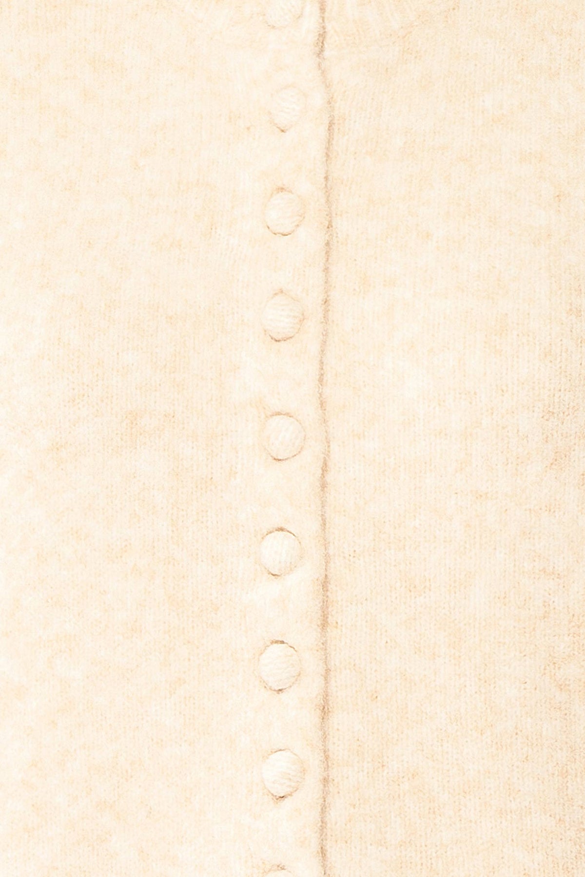 fabric view of Idalia Ivory Round Neck Cardigan With Button Front at Boutique 1861