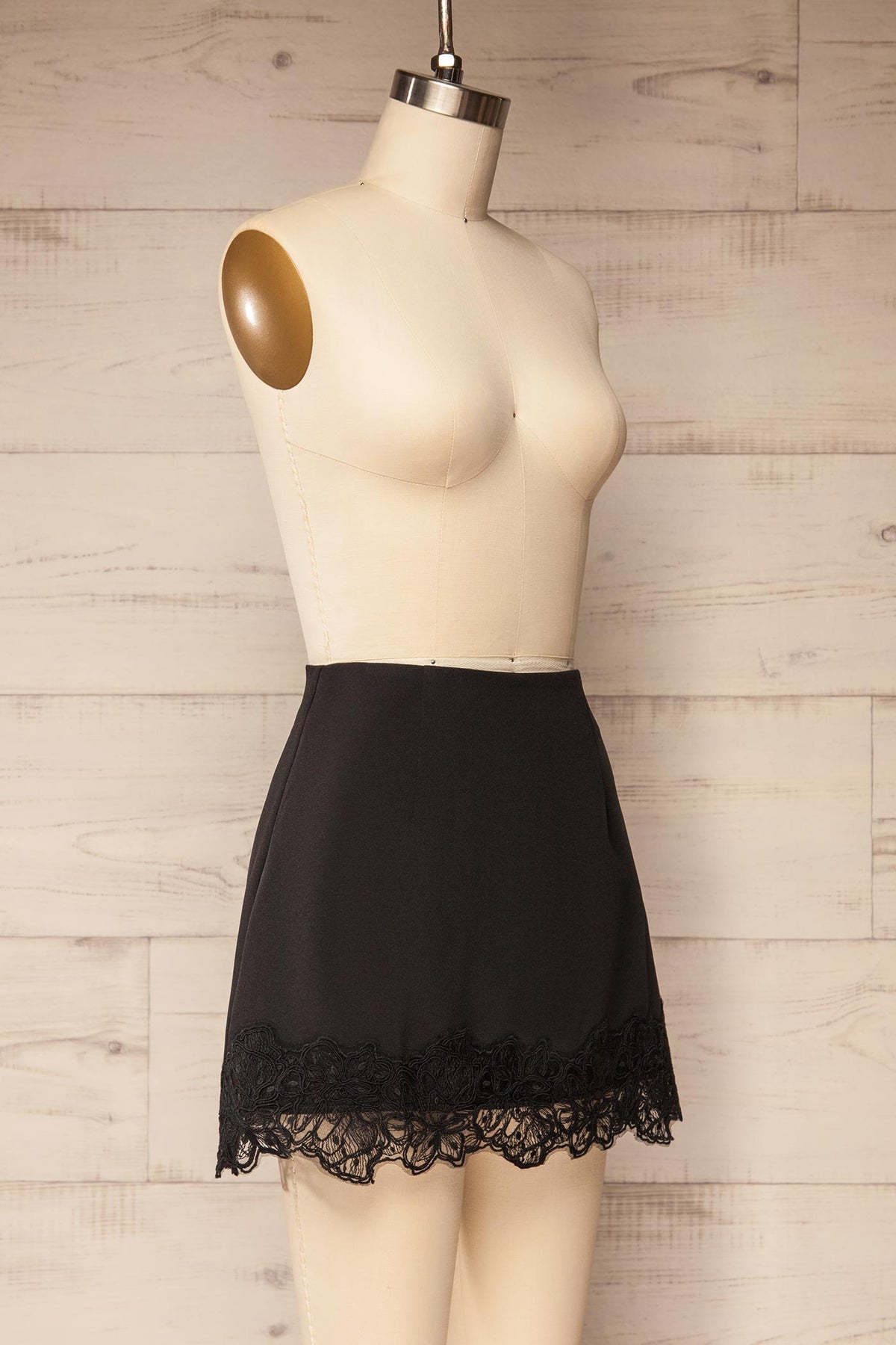 side view of Imilda Black Lace-Trim Mini Skirt with Built-In Shorts at La petite garçonne