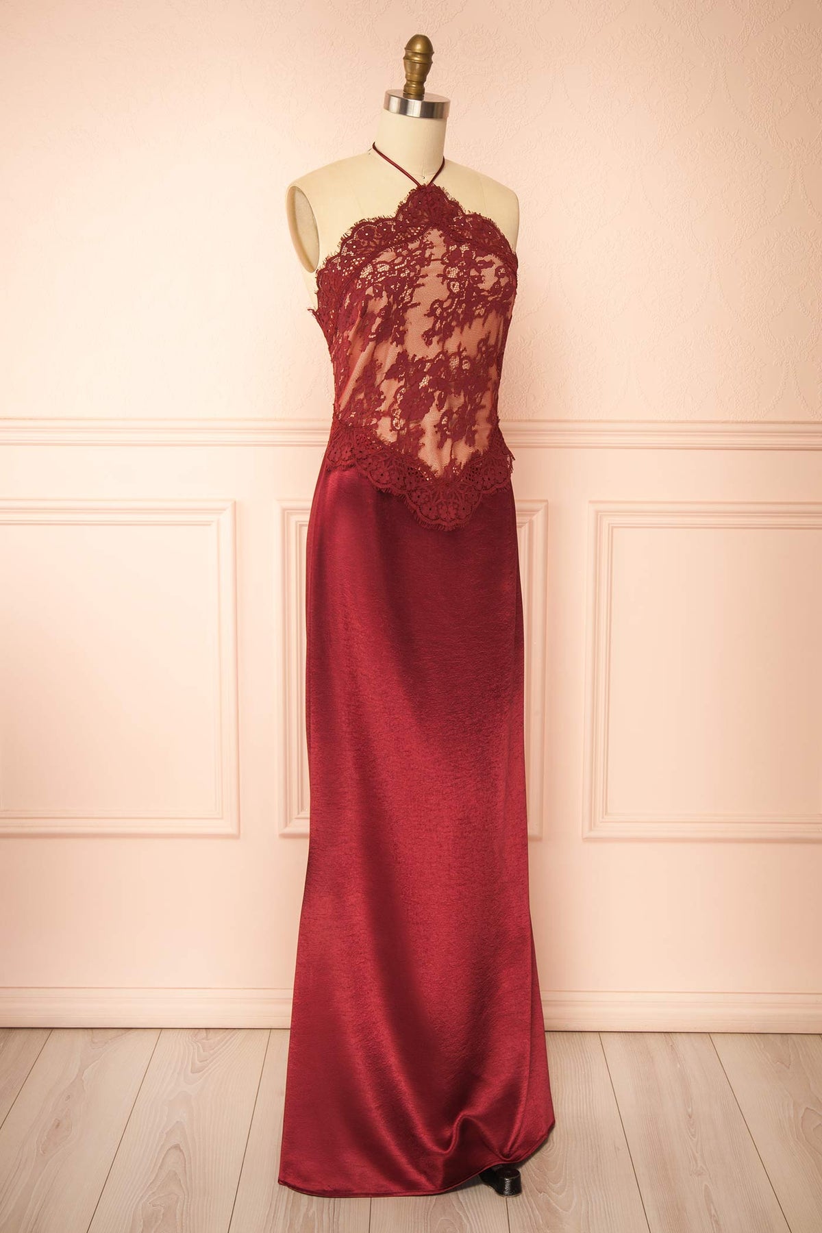 side view of Irimia Burgundy Maxi Satin Halter Dress with Open Back at Boutique 1861