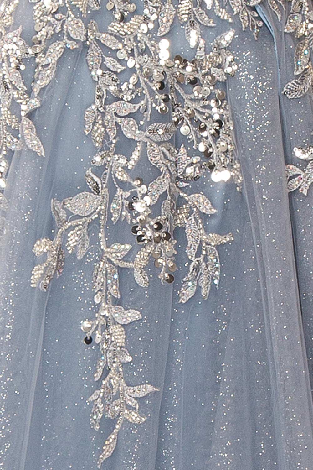 Jayden Maxi Blue Dress with Floral Beading | Boutique 1861of a woman wearing fabric