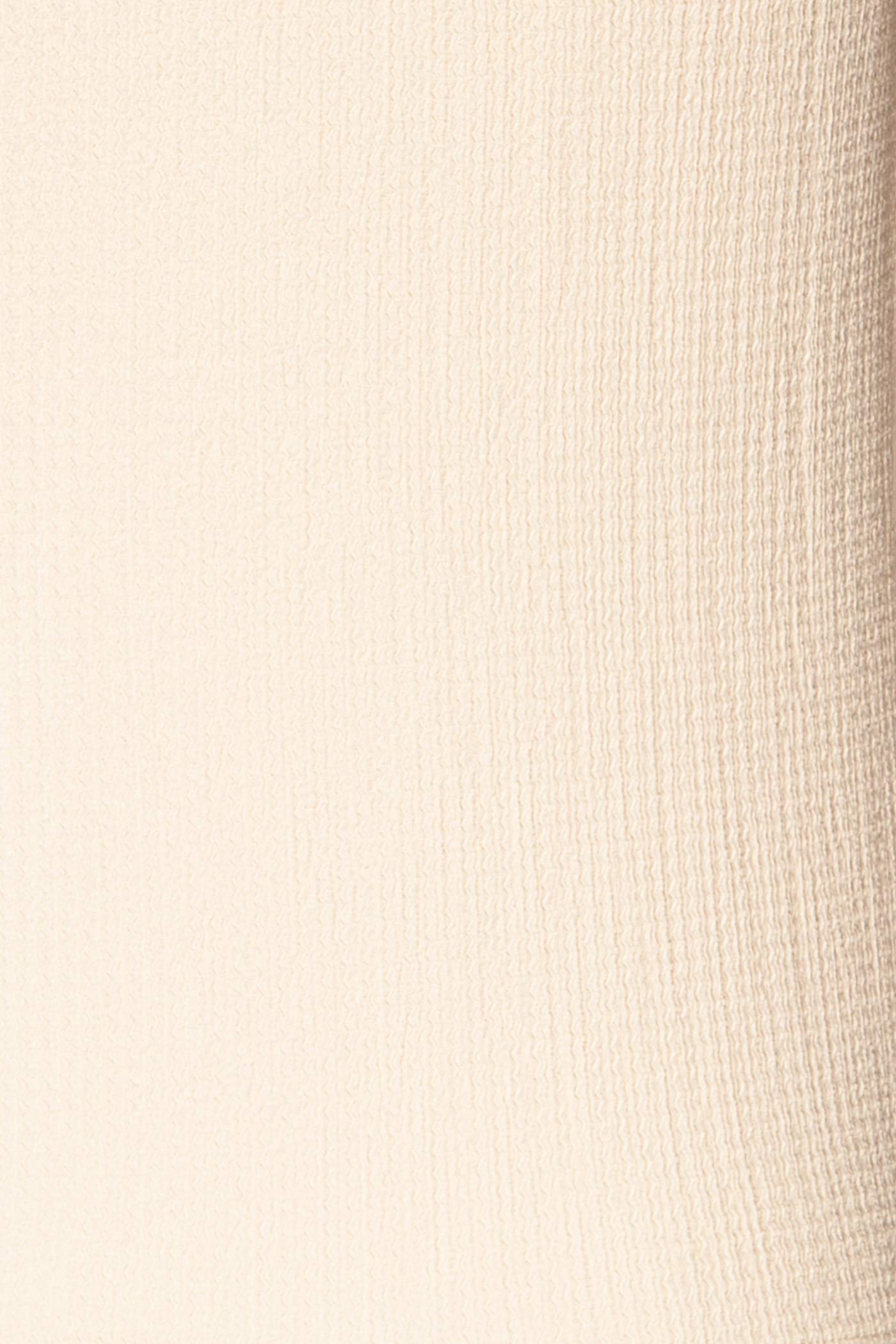 Close-up view Kannur Ivory Textured Tie-Front Sleeveless Top at la petite garçonne