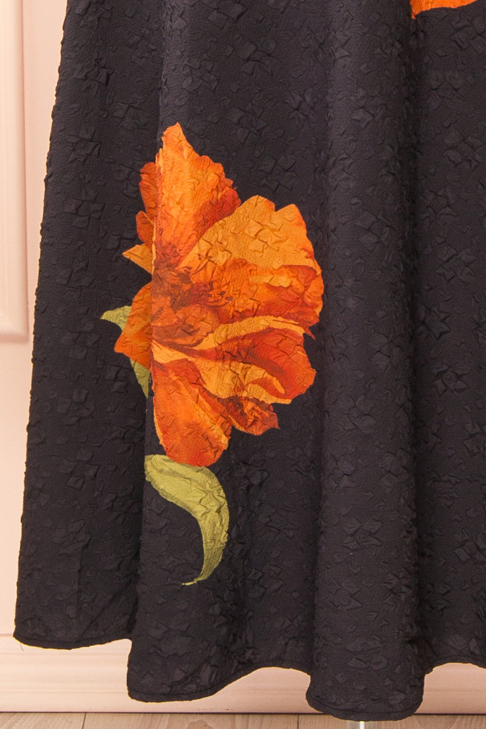 bottom of a Mannequin wearing the Kerina Midi Floral Strapless Dress from boutique 1861