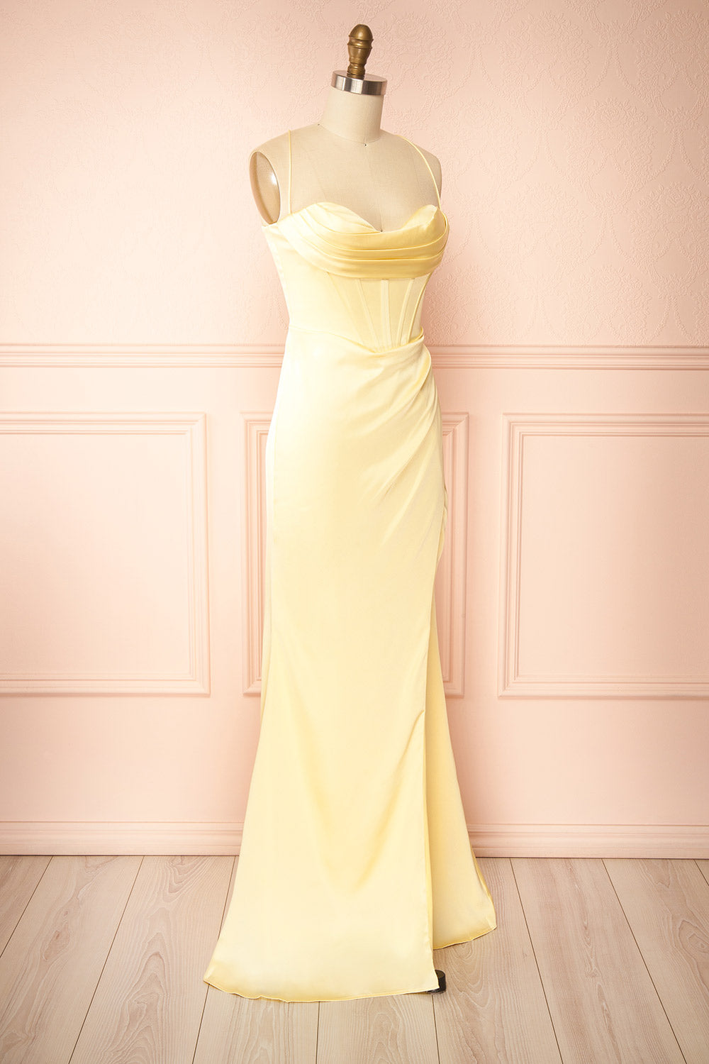 side view of sewing mannequin wearing Kesha Light Yellow Corset Cowl Neck Maxi Dress | Boutique 1861