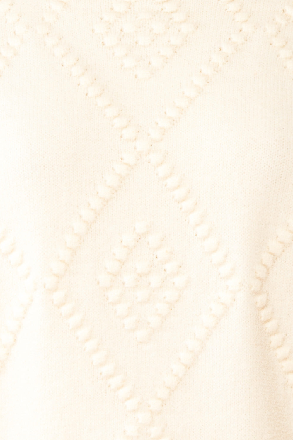 Kumari Textured Ivory Knit Sweater | Boutique 1861 fabric