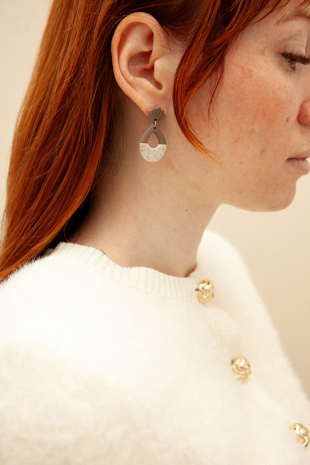 woman wearing Lampo Brown Pendant Earrings w/ Shells from La petite garçonne