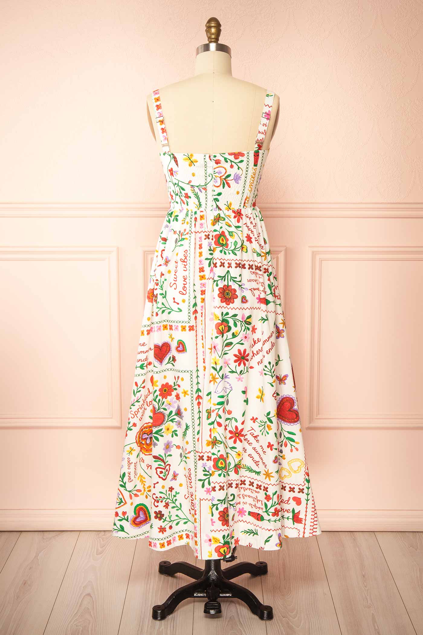 Back view Lauria White Folk-Art Floral Print Smocked Midi Dress at boutique 1861