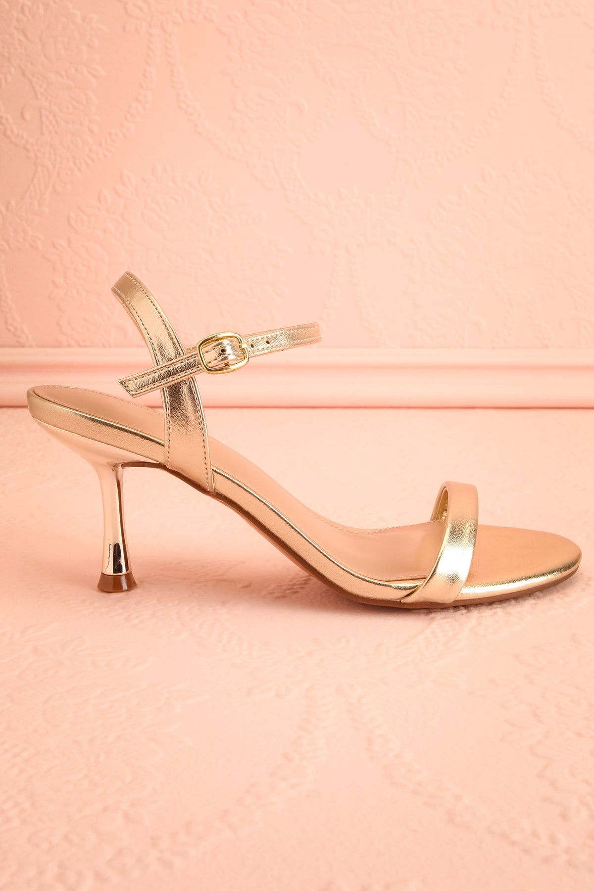 Side view of Liatris Gold Ankle Strap Kitten Heel Sandals at Boutique 1861 in Montreal