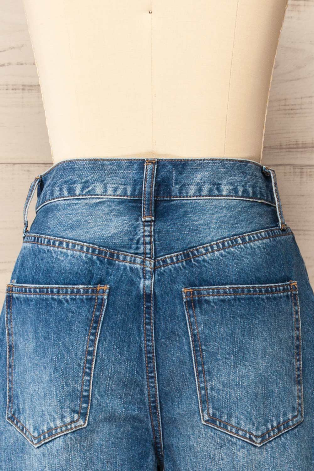 Macau Medium Wash Crossover High-Waisted Jeans | La petite garçonne back