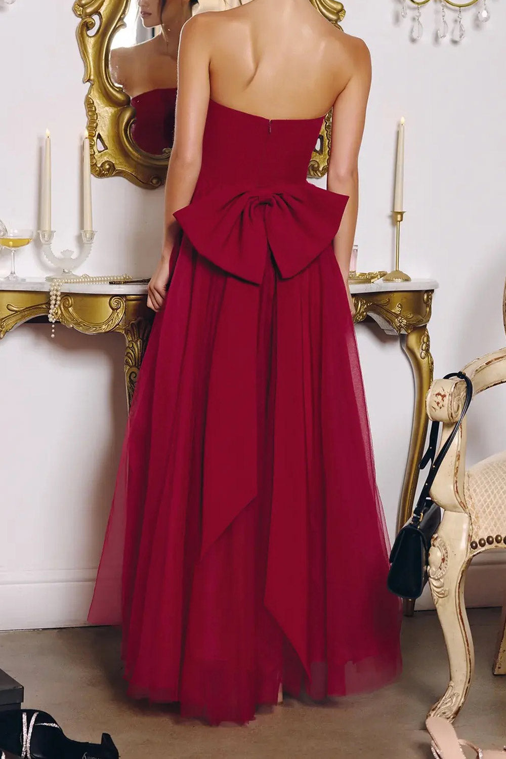 back view of a woman wearing Makoto Burgundy Maxi Strapless A-Line Dress from Boutique 1861