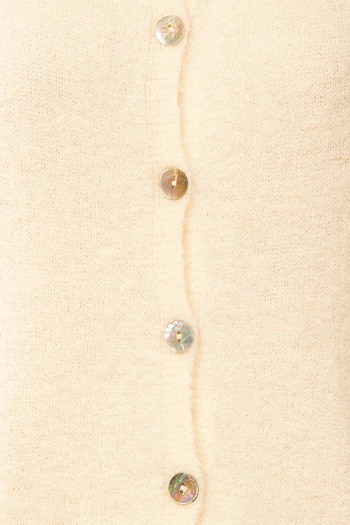 fabric view of Megumi Ivory Button-Front Knit Cardigan at La petite garçonne