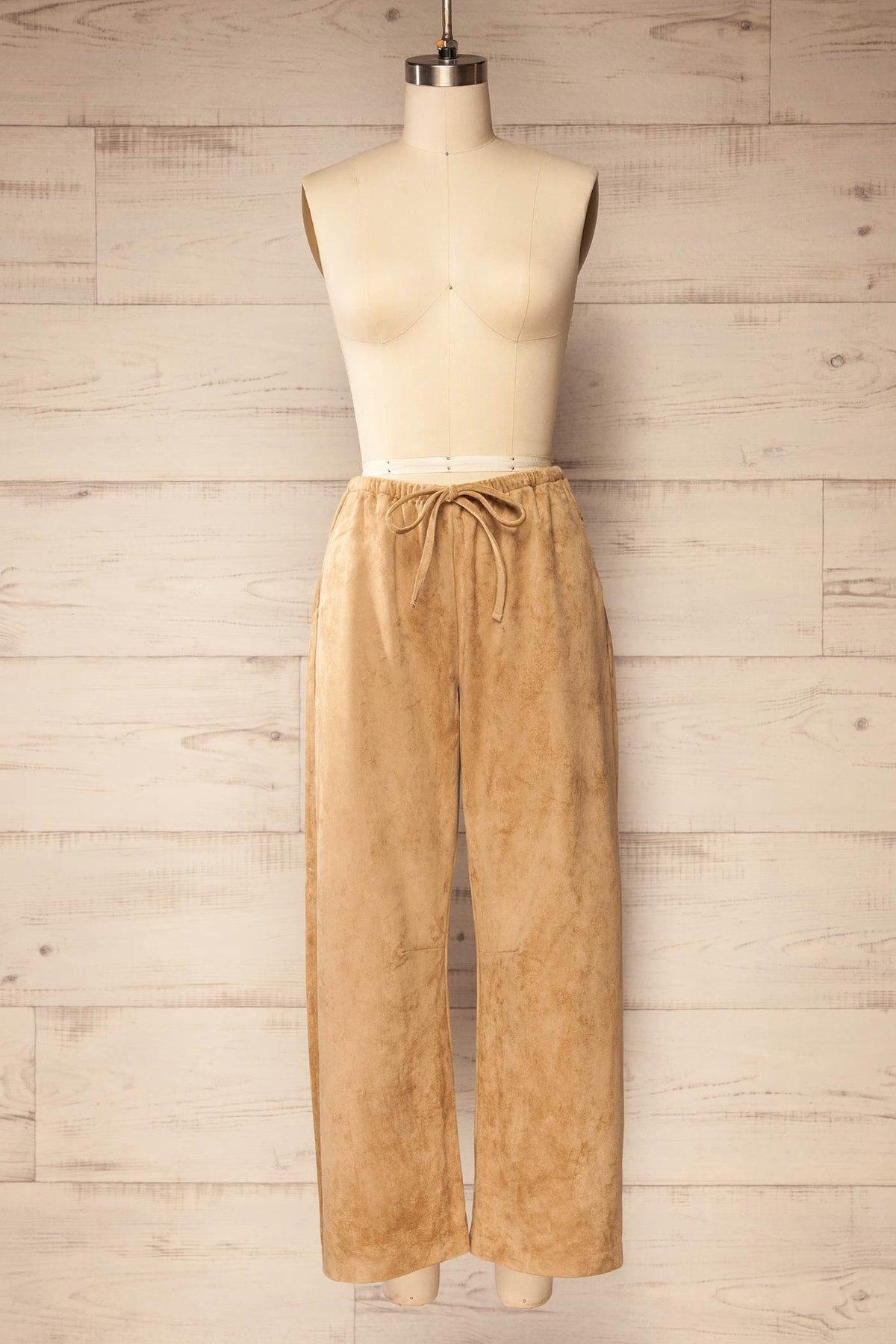 front view of Merasheen Beige Faux Suede Pants at La petite garçonne
