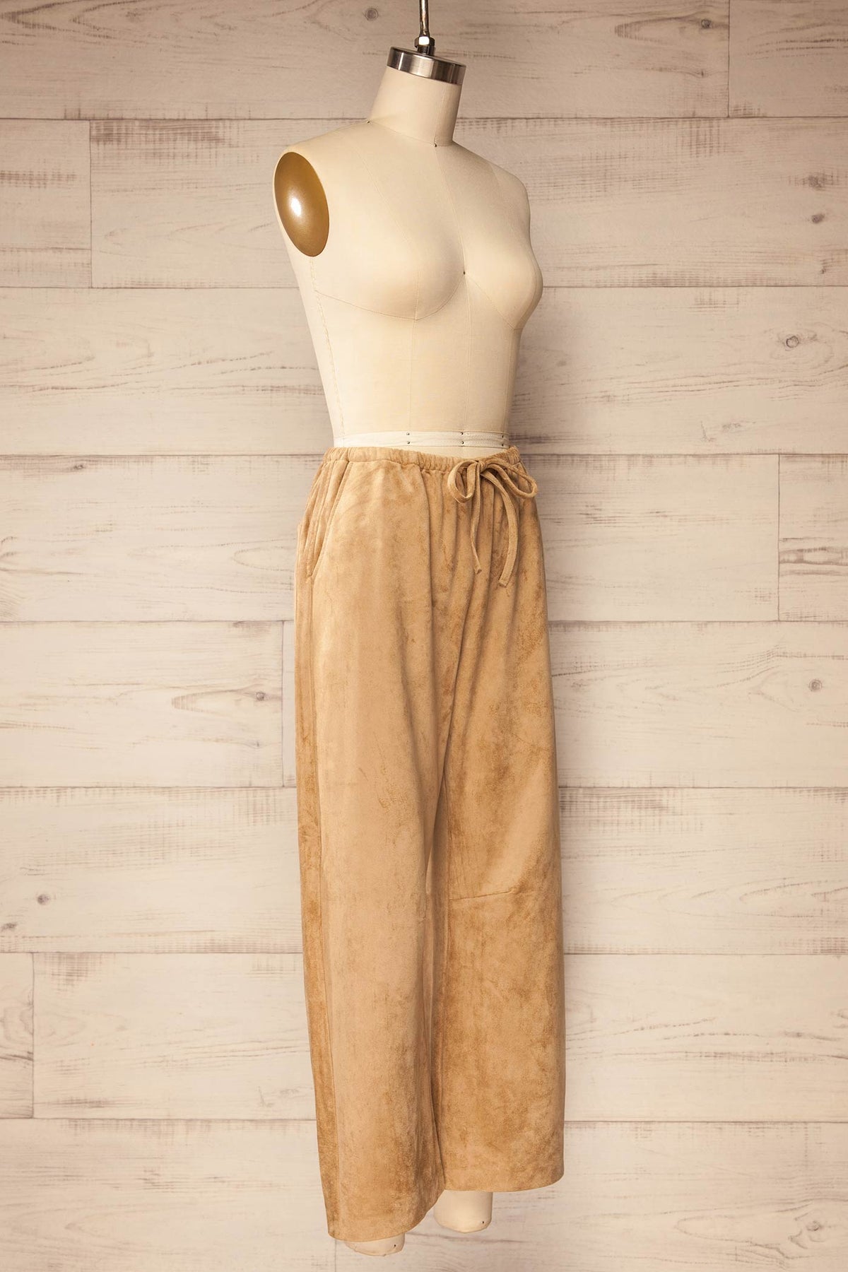 side view of Merasheen Beige Faux Suede Pants at La petite garçonne
