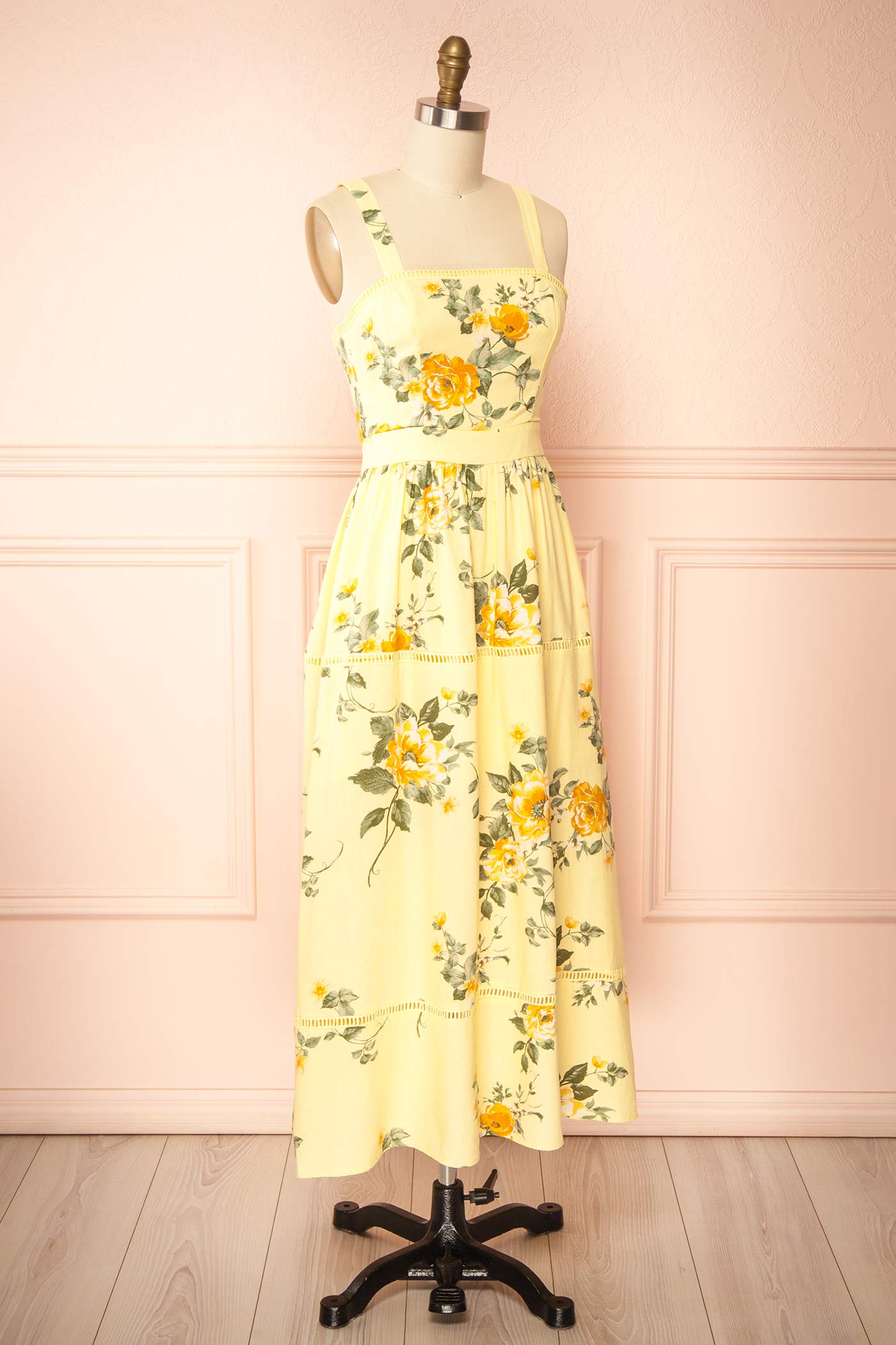 Sideview of Najwa Yellow Midi Dress with Floral Pattern at boutique 1861