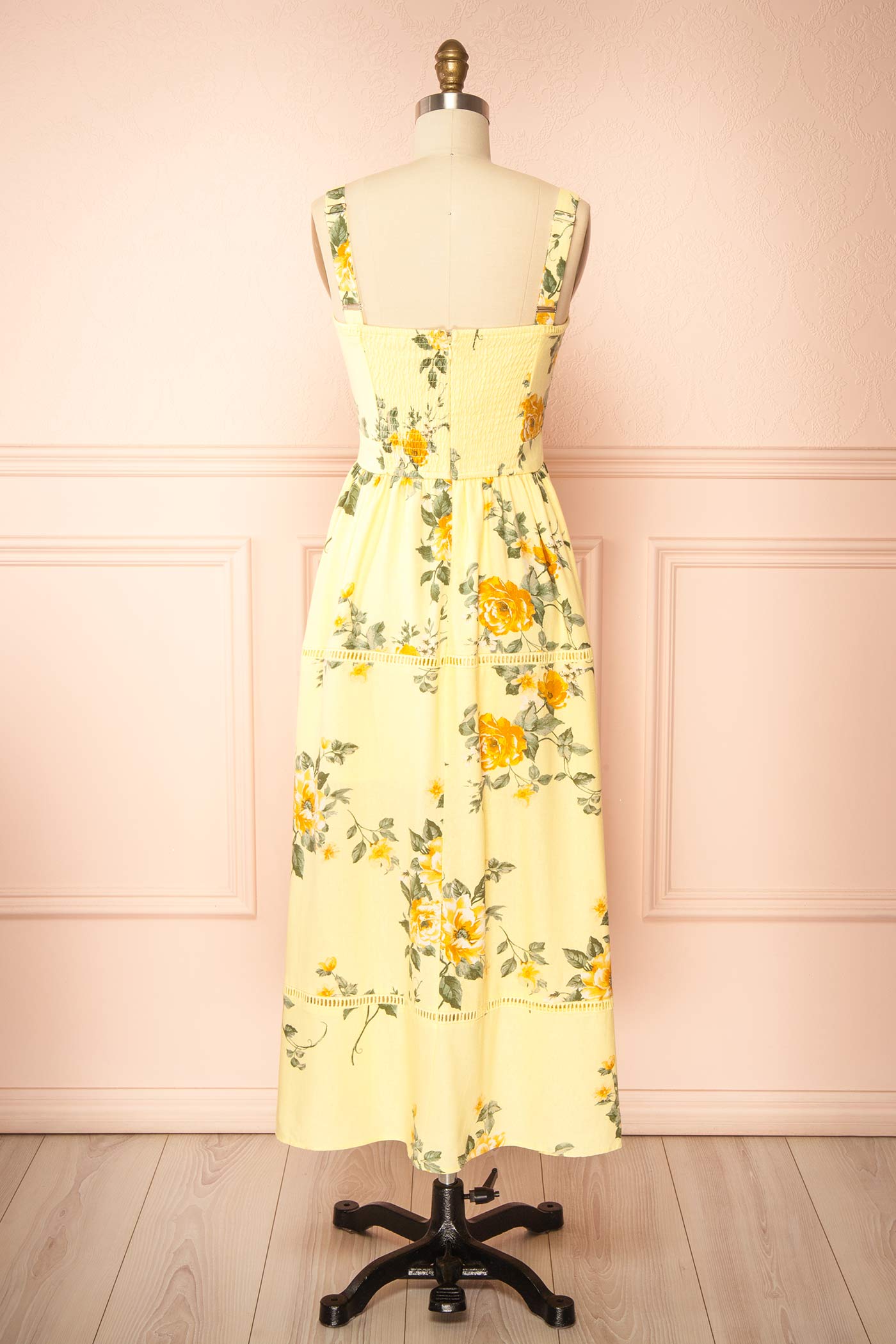 Backview of Najwa Yellow Midi Dress with Floral Pattern at boutique 1861