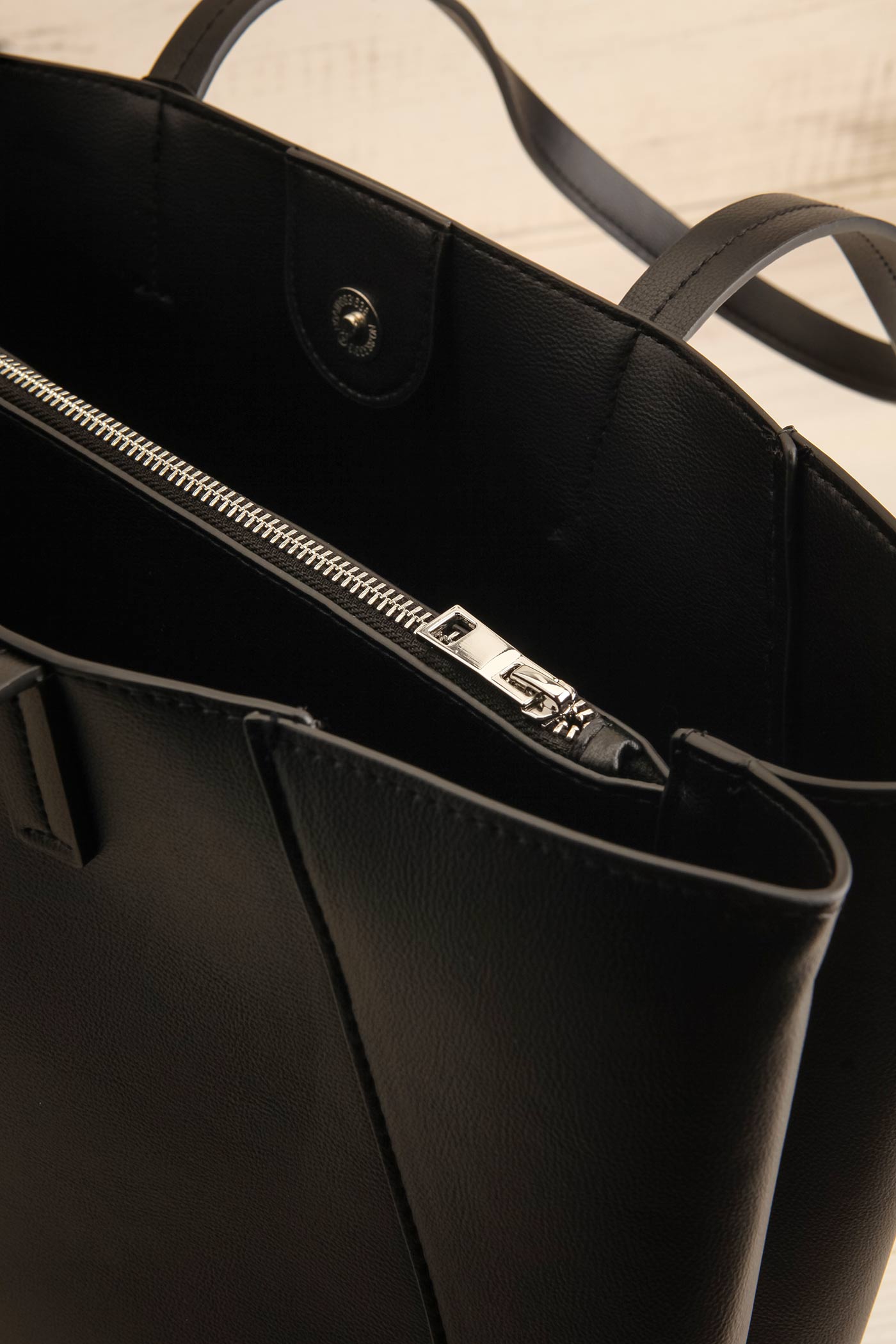 inside view of Nanika Black Faux-Leather Tote Bag at La petite garçonne