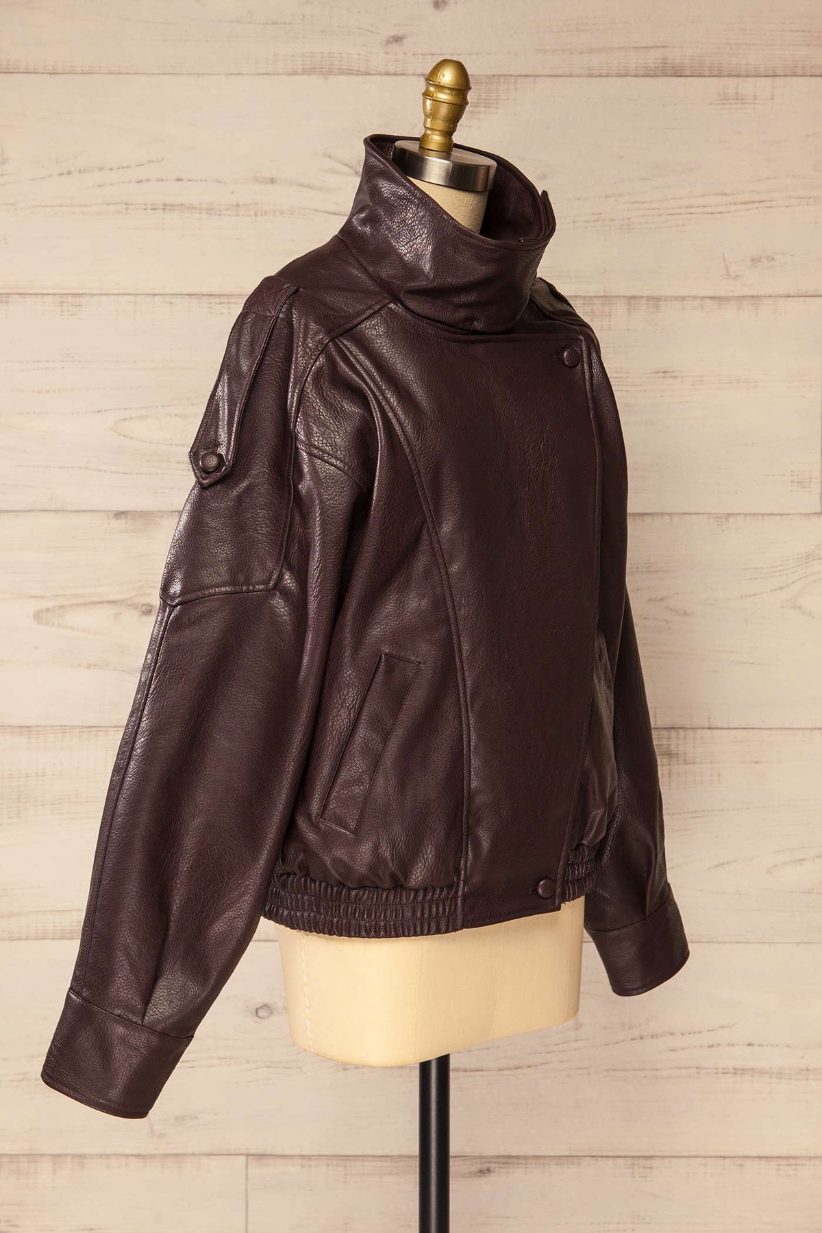 side view of Navarrenx Brown Faux Leather High Collar Jacket at La petite garçonne