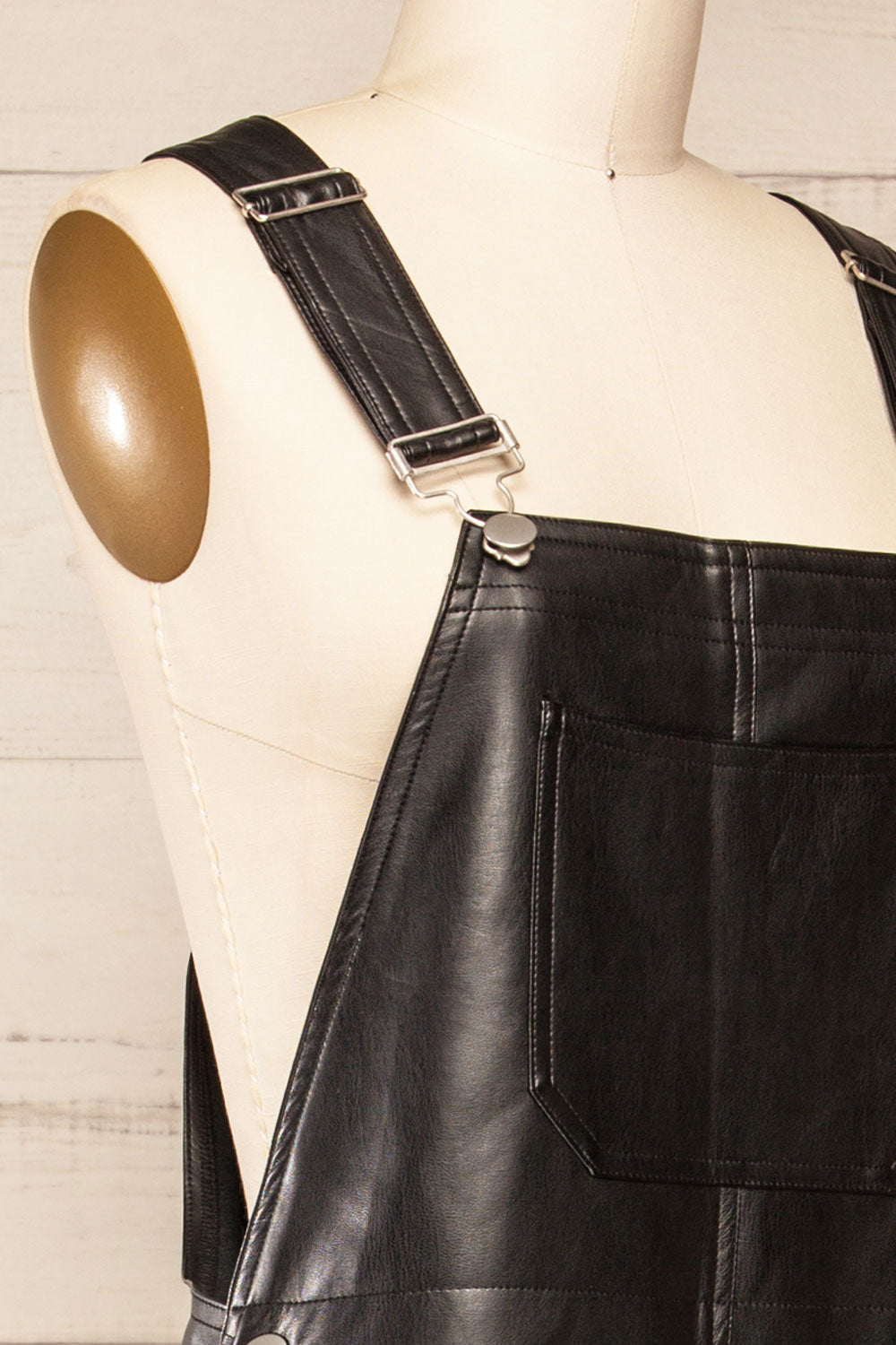 Ndjamena Black Faux Leather Overalls | La petite garçonne side close-up