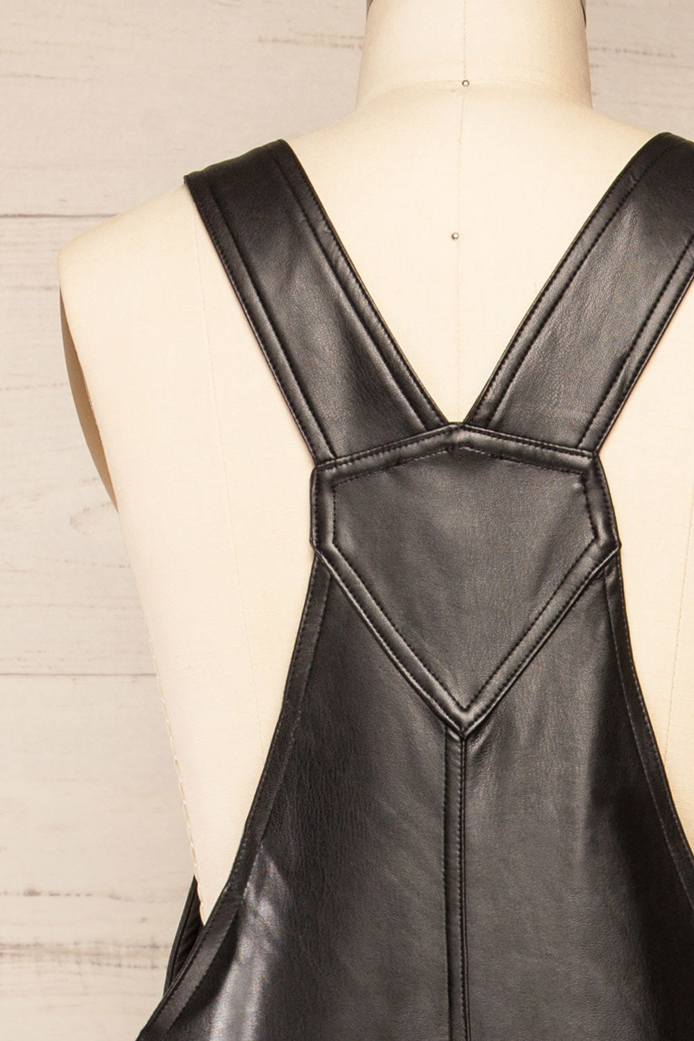 Ndjamena Black Faux Leather Overalls | La petite garçonne back close-up