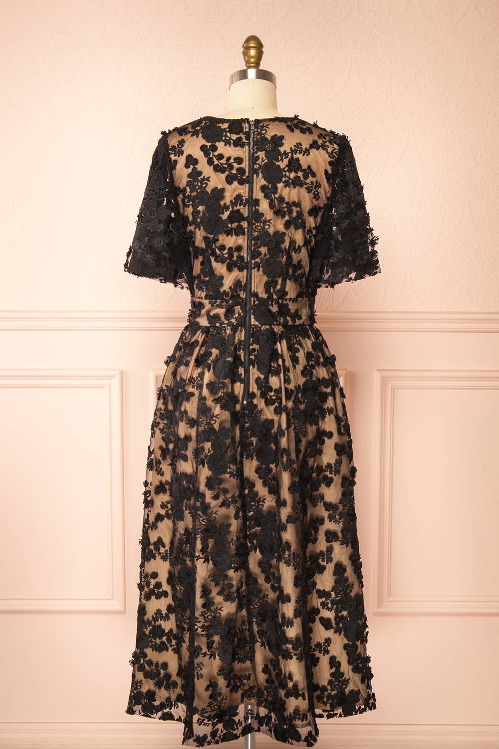 back view of a Mannequin wearing the Oukie Black Midi Floral Lace Dress from boutique 1861