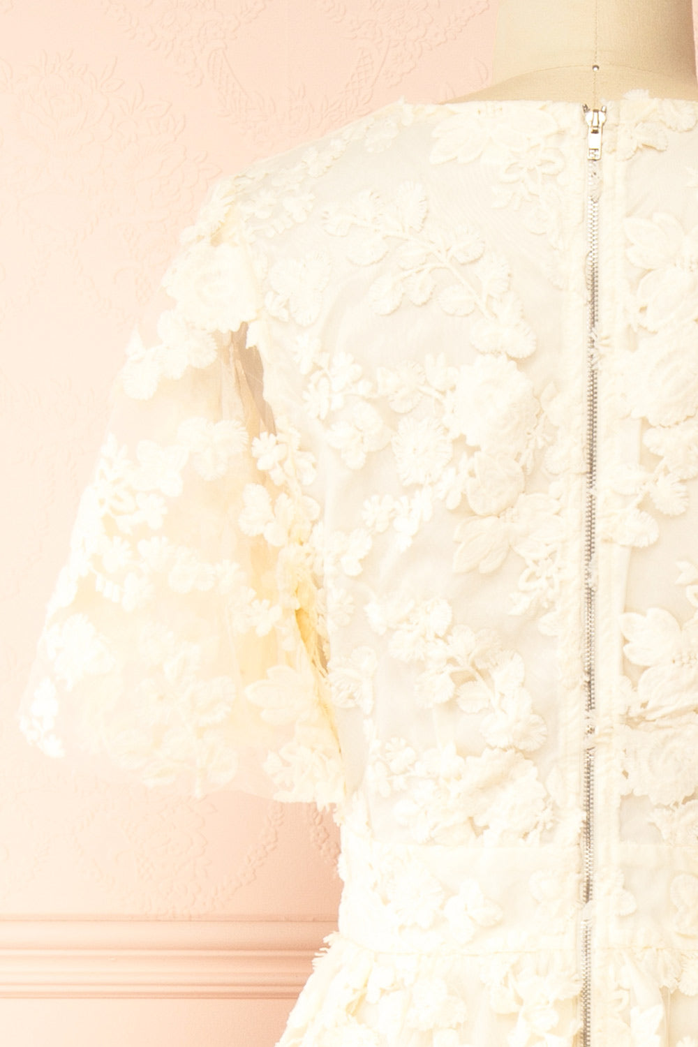 back of a Mannequin wearing the Oukie Ivory Midi Floral Lace Dress from boutique 1861