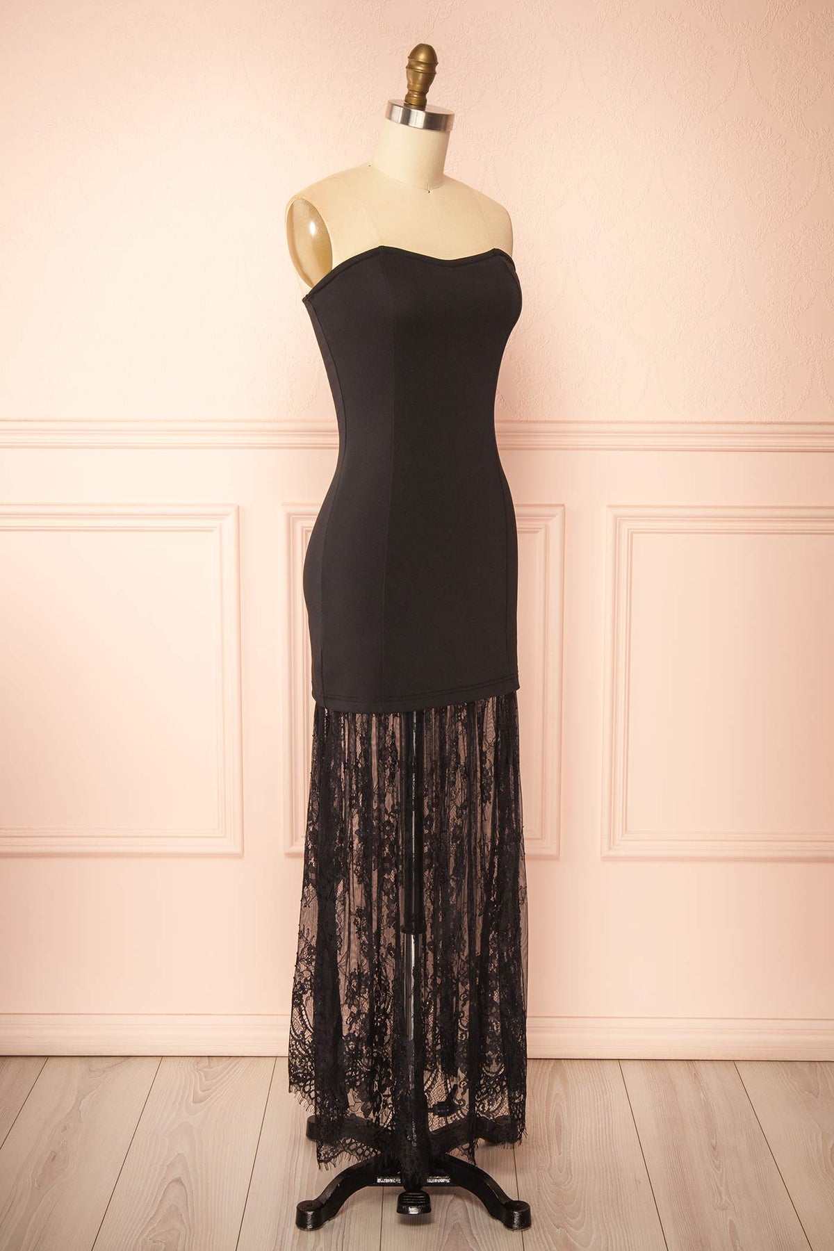 side view of Peronia Black Strapless Maxi Dress with Sheer Lace Hem at Boutique 1861