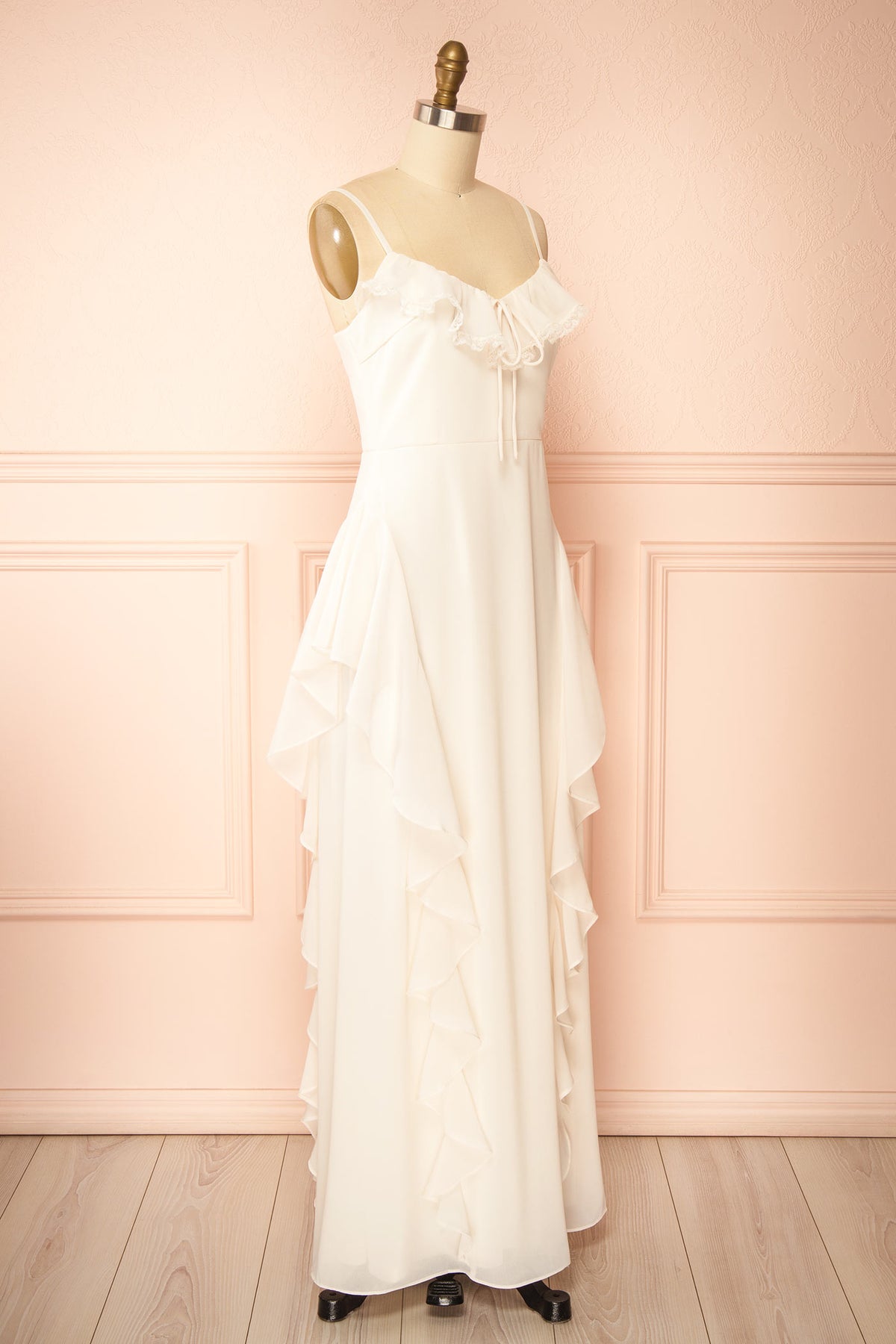 side view of Petria Ivory Ruffled Accent Sleeveless Maxi Dress with Front Tie at Boutique 1861