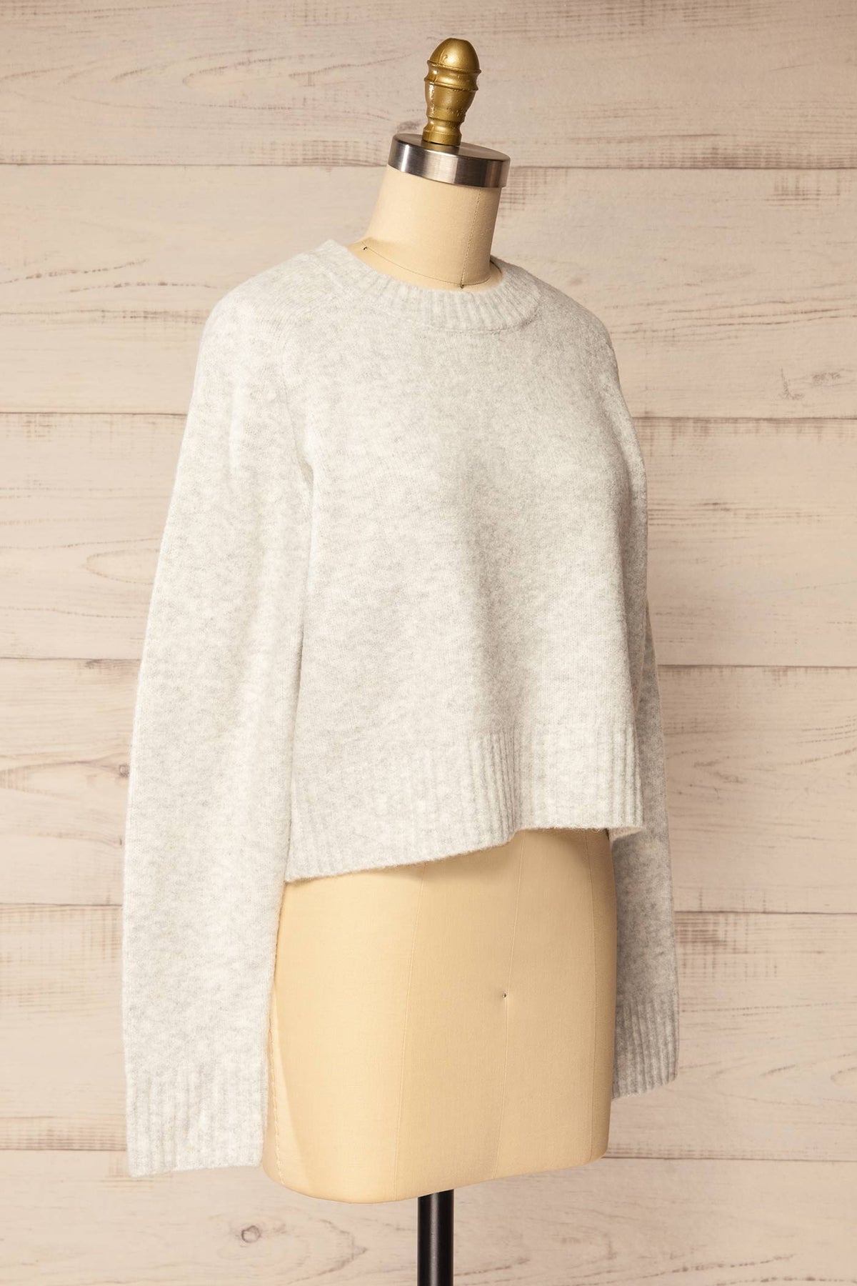 side view of Philemire Light Grey Crew Neck Cropped Knit Sweater at La petite garçonne