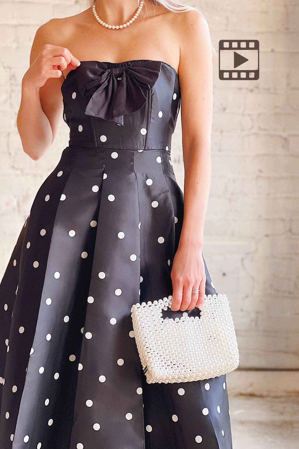 Video of Nesrine Strapless Black Dress with White Polka Dots on a model at Boutique 1861