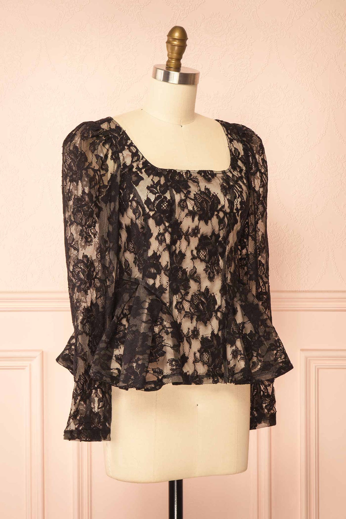 side view of Rabellia Black Floral Lace Peplum Top at Boutique 1861