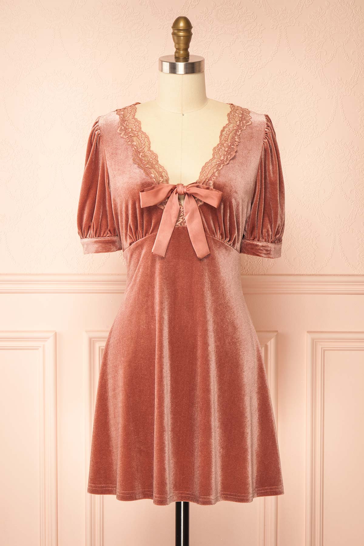 front view of Rejeane Mauve Velvet Puff Sleeve Mini Dress with Lace Trim and Front Bow at Boutique 1861