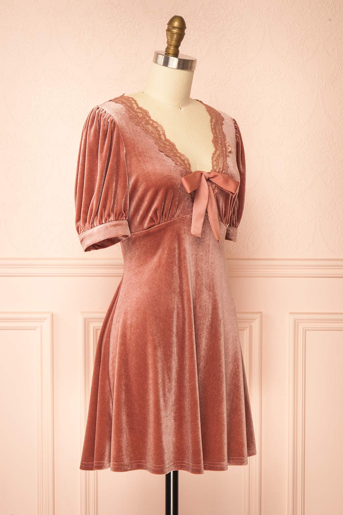 side view of Rejeane Mauve Velvet Puff Sleeve Mini Dress with Lace Trim and Front Bow at Boutique 1861