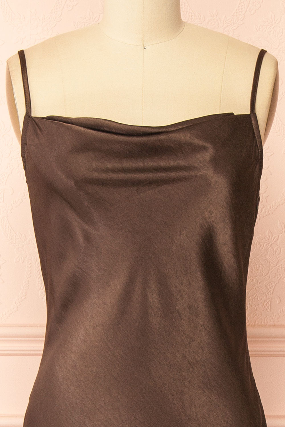 front of a Mannequin wearing the Safiya brown Satin Maxi Dress with Faux Fur Shawl from boutique 1861