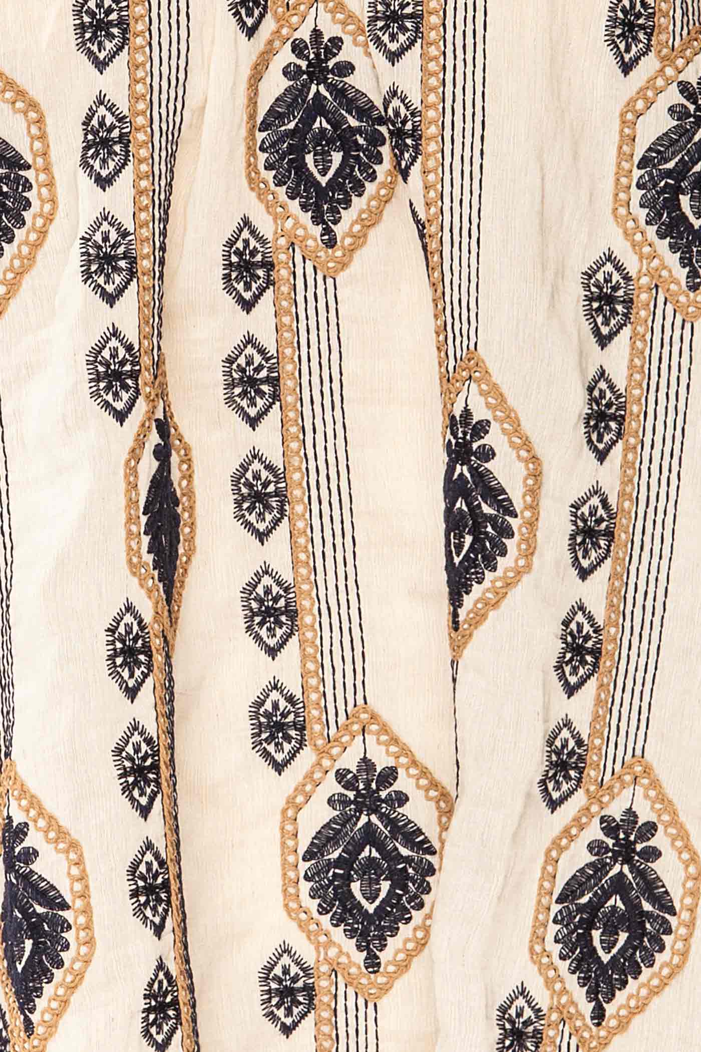Close-up Sancole Ivory High-Neck Blouse Geometric Embroidery at la petite garçonne