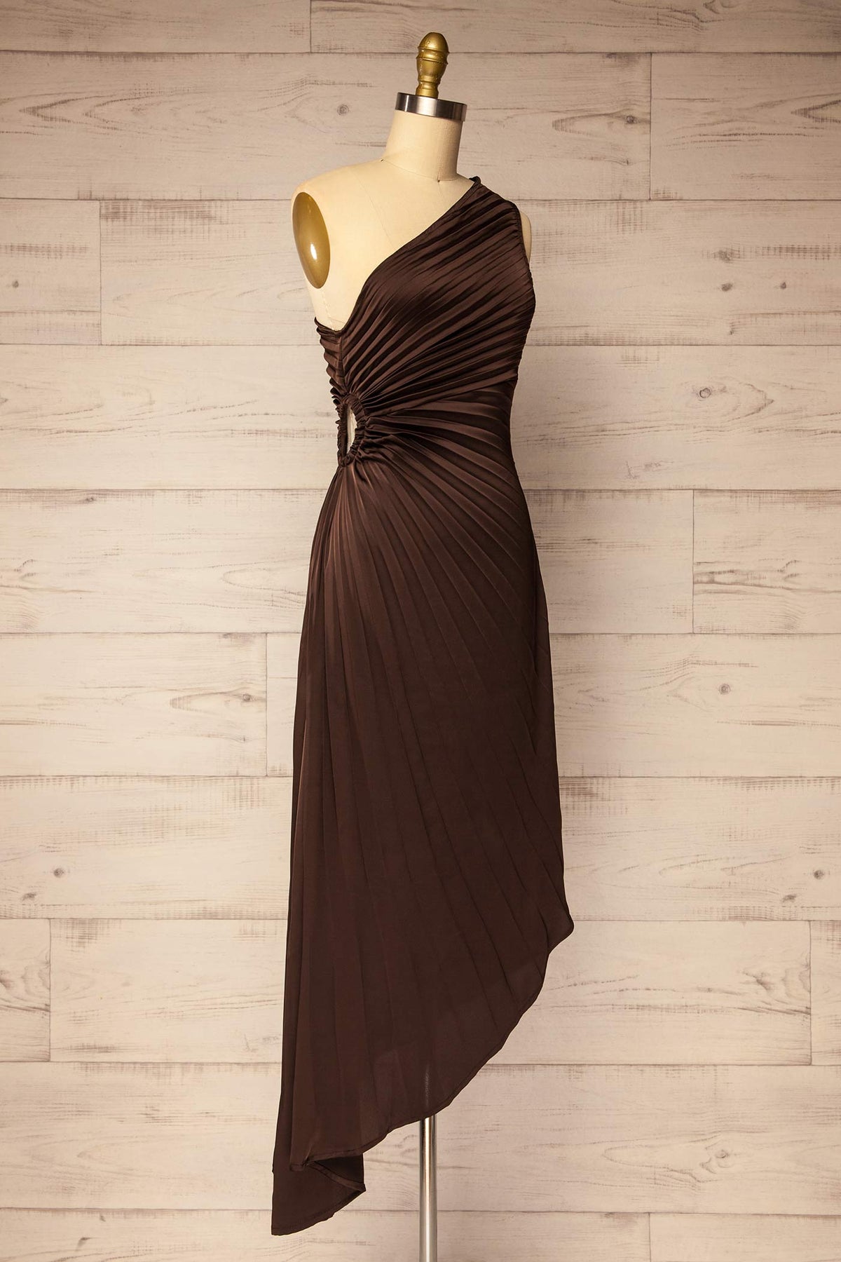 side view of Shibuya Brown Pleated Satin Asymmetrical Dress at La petite garçonne